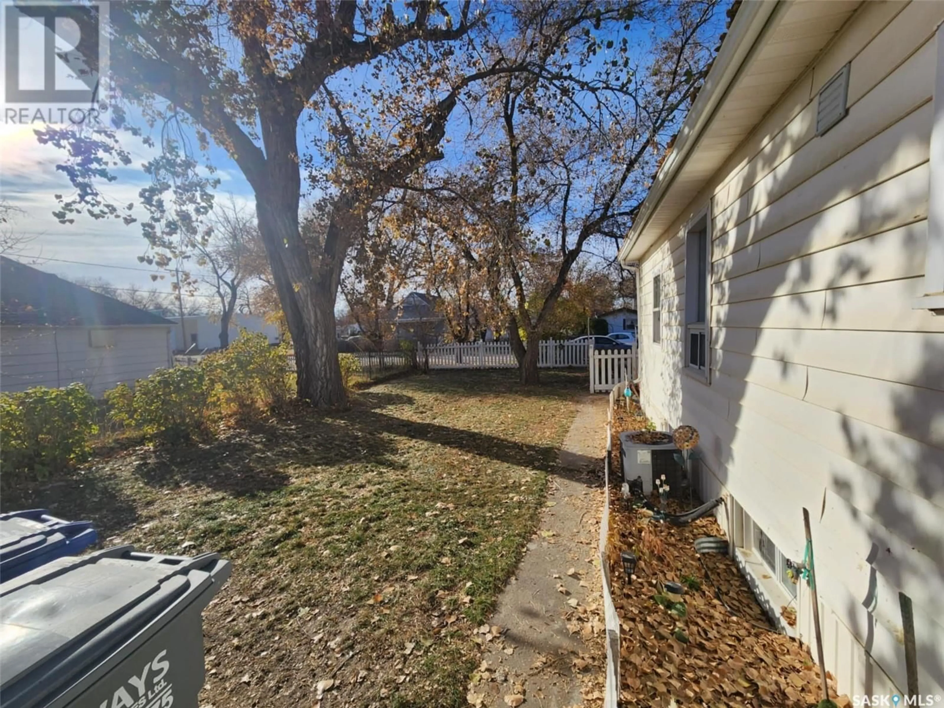 A pic from exterior of the house or condo, the fenced backyard for 317 3rd STREET, Chaplin Saskatchewan S0H0V0