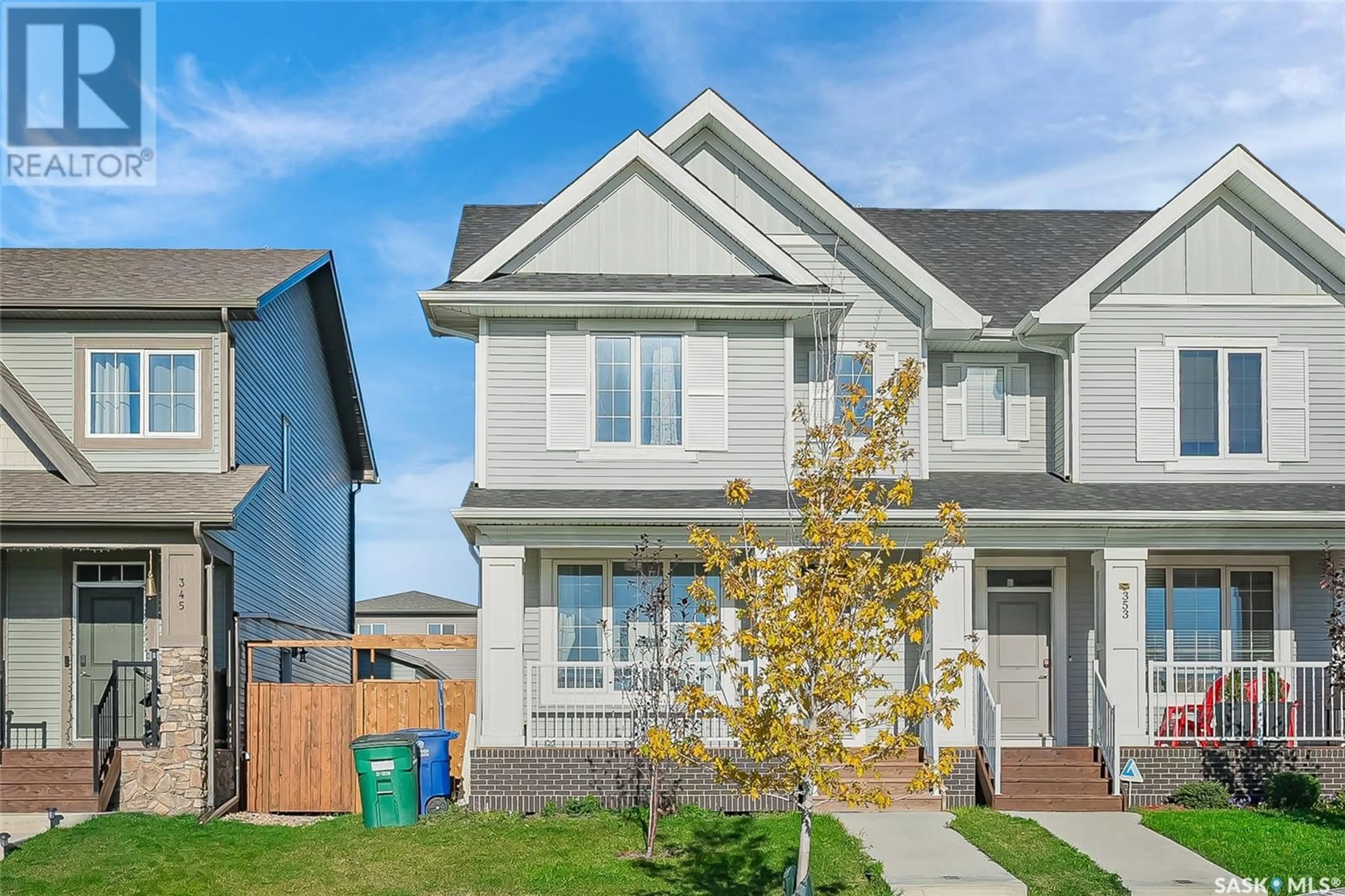 Frontside or backside of a home, the fenced backyard for 349 Brighton BOULEVARD, Saskatoon Saskatchewan S7V0R5