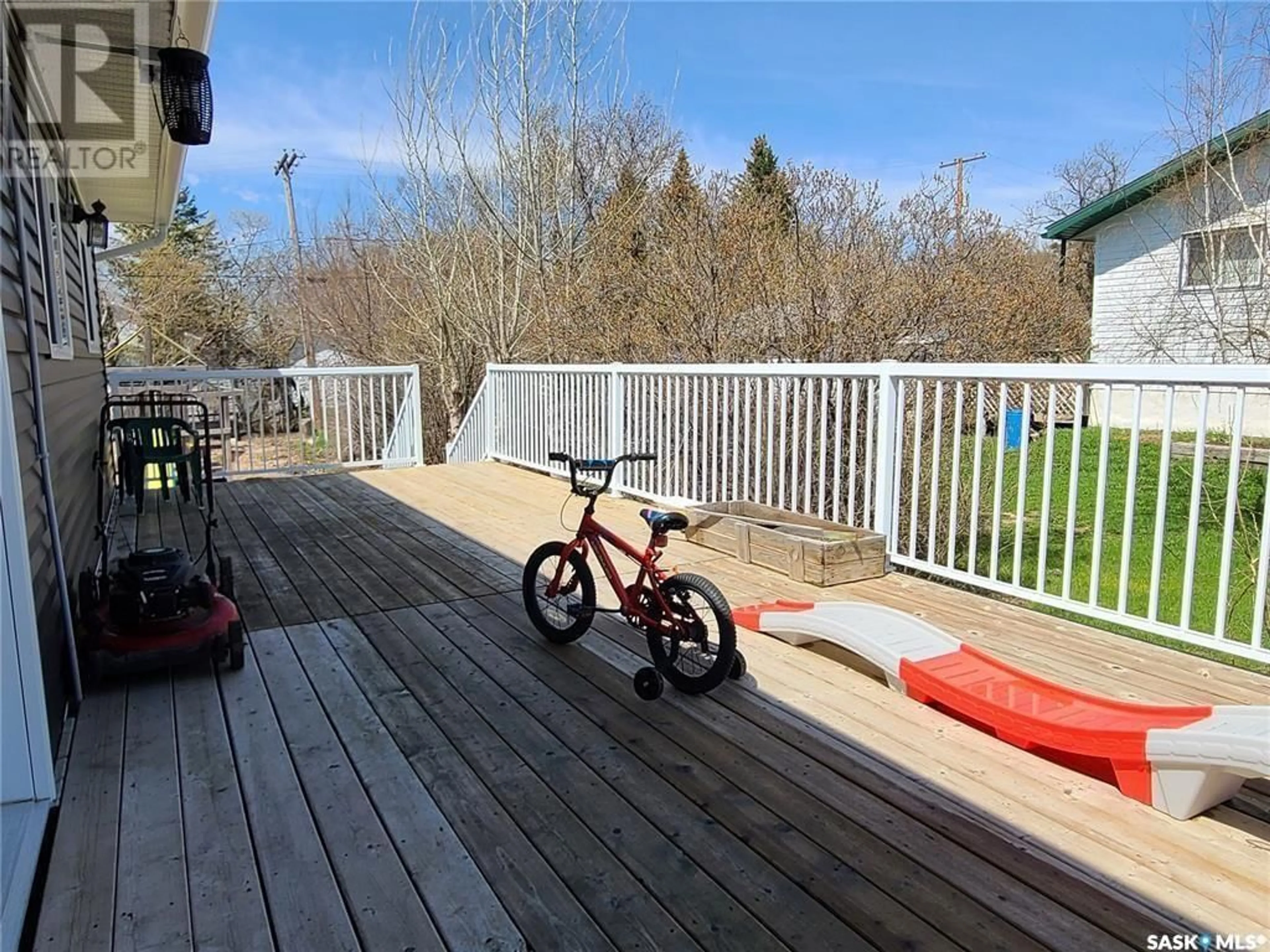 Frontside or backside of a home, the fenced backyard for 46 Newcombe STREET, Manor Saskatchewan S0C1R0