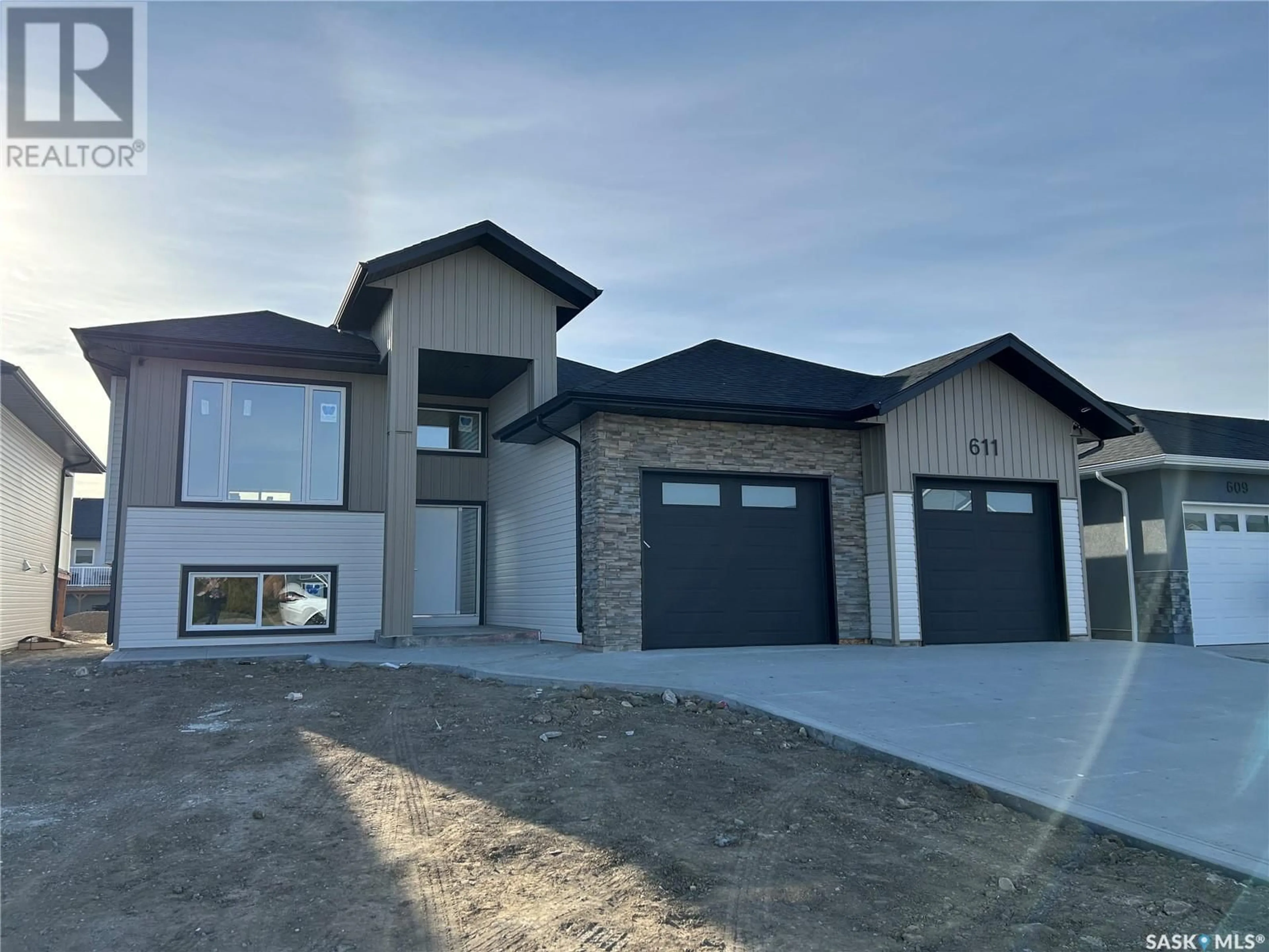 Frontside or backside of a home, the street view for 611 Pebble Beach BOULEVARD, Warman Saskatchewan S0K4S1