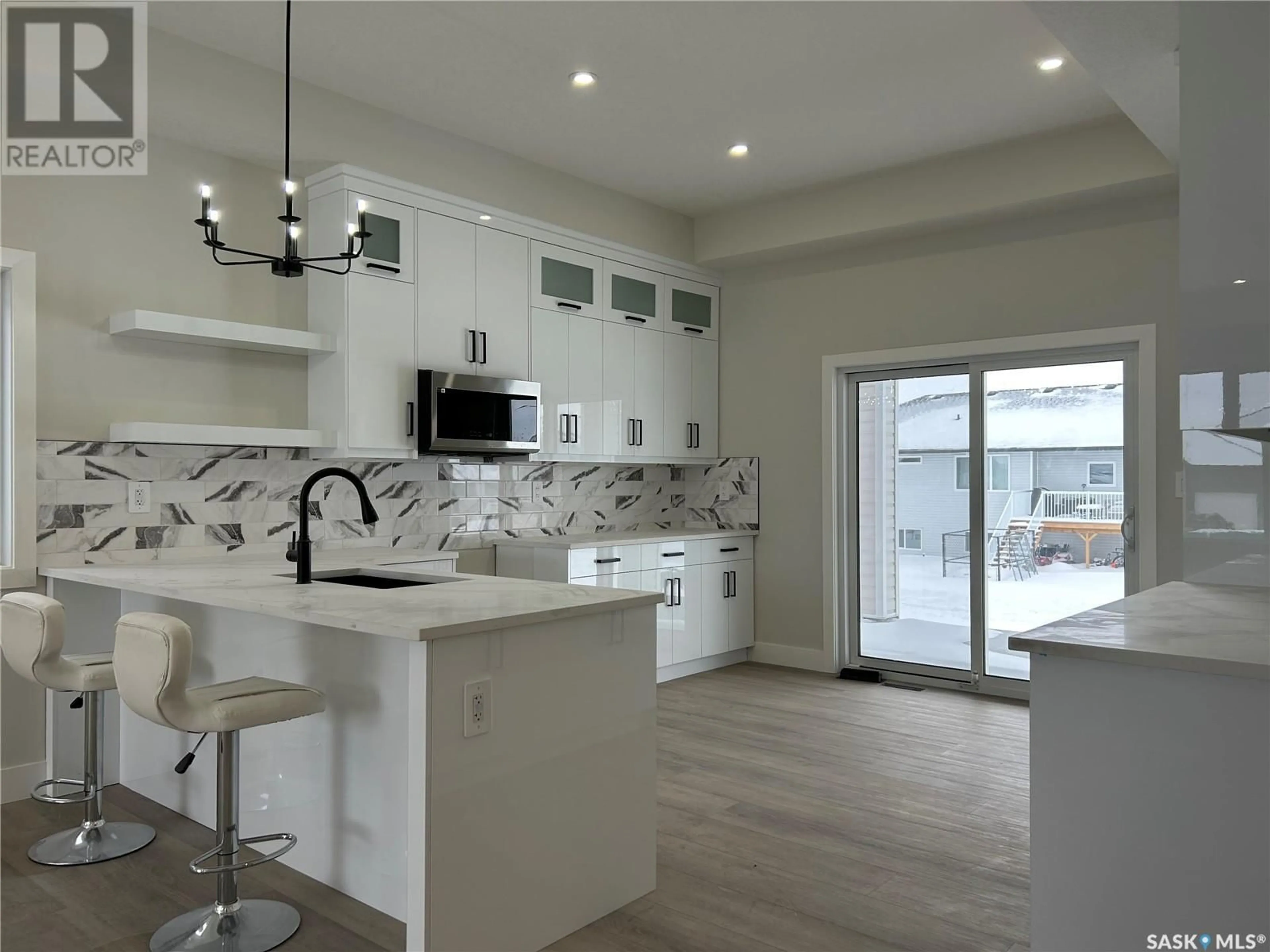 Open concept kitchen, ceramic/tile floor for 611 Pebble Beach BOULEVARD, Warman Saskatchewan S0K4S1