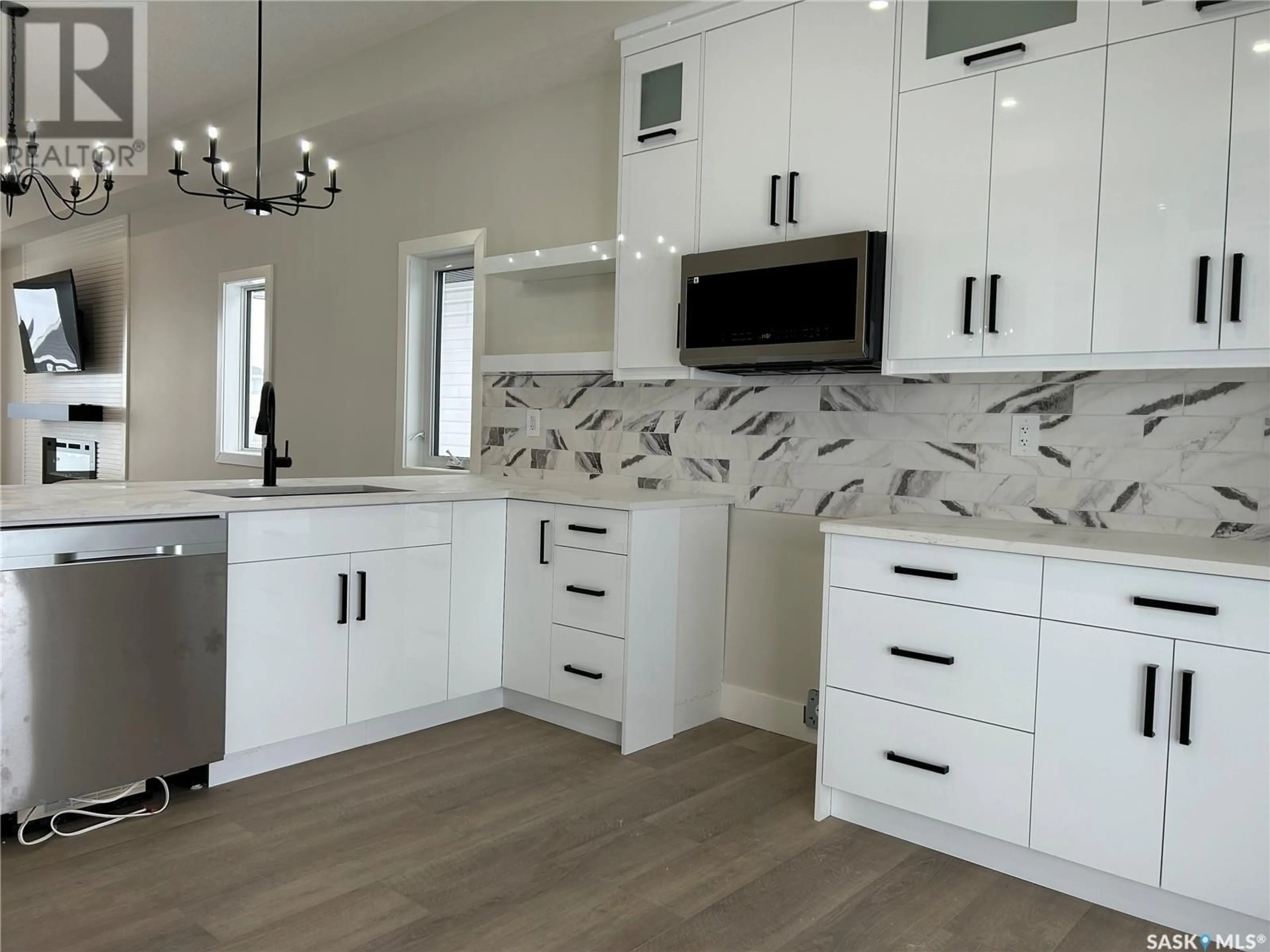 Open concept kitchen, ceramic/tile floor for 611 Pebble Beach BOULEVARD, Warman Saskatchewan S0K4S1