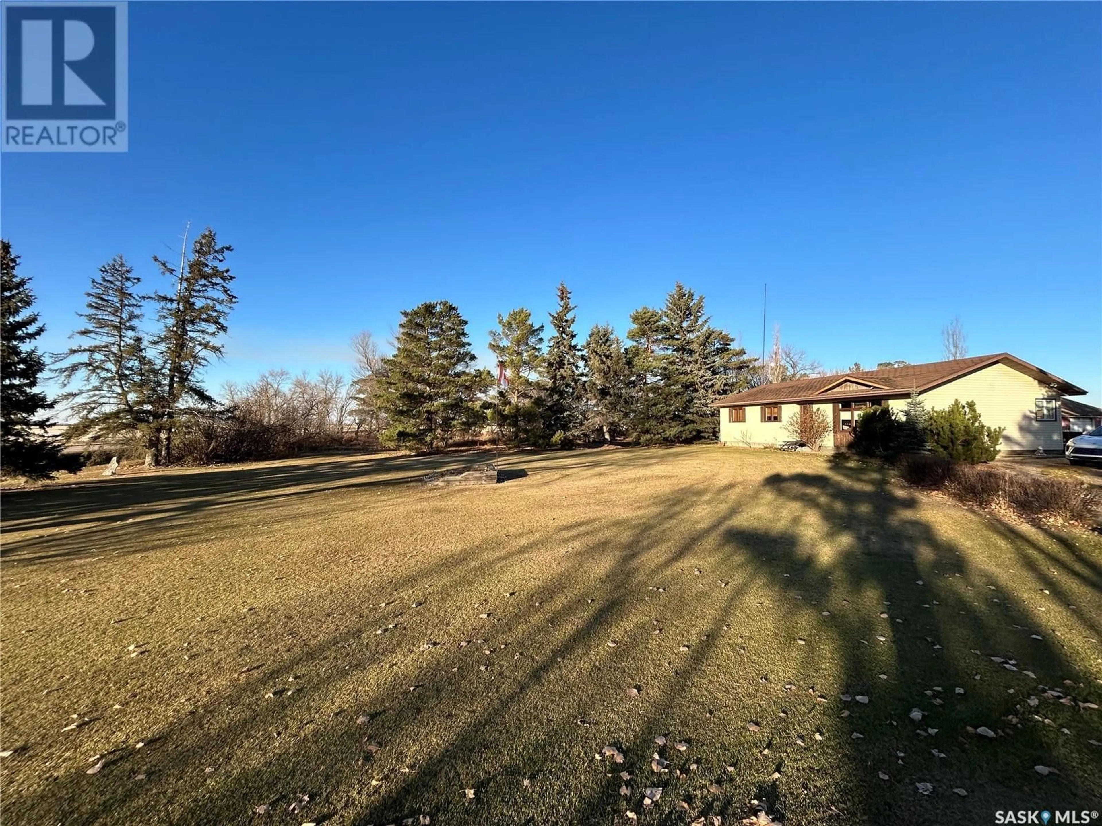 Frontside or backside of a home, the fenced backyard for McKee Acreage, Golden West Rm No. 95 Saskatchewan S0G0X0