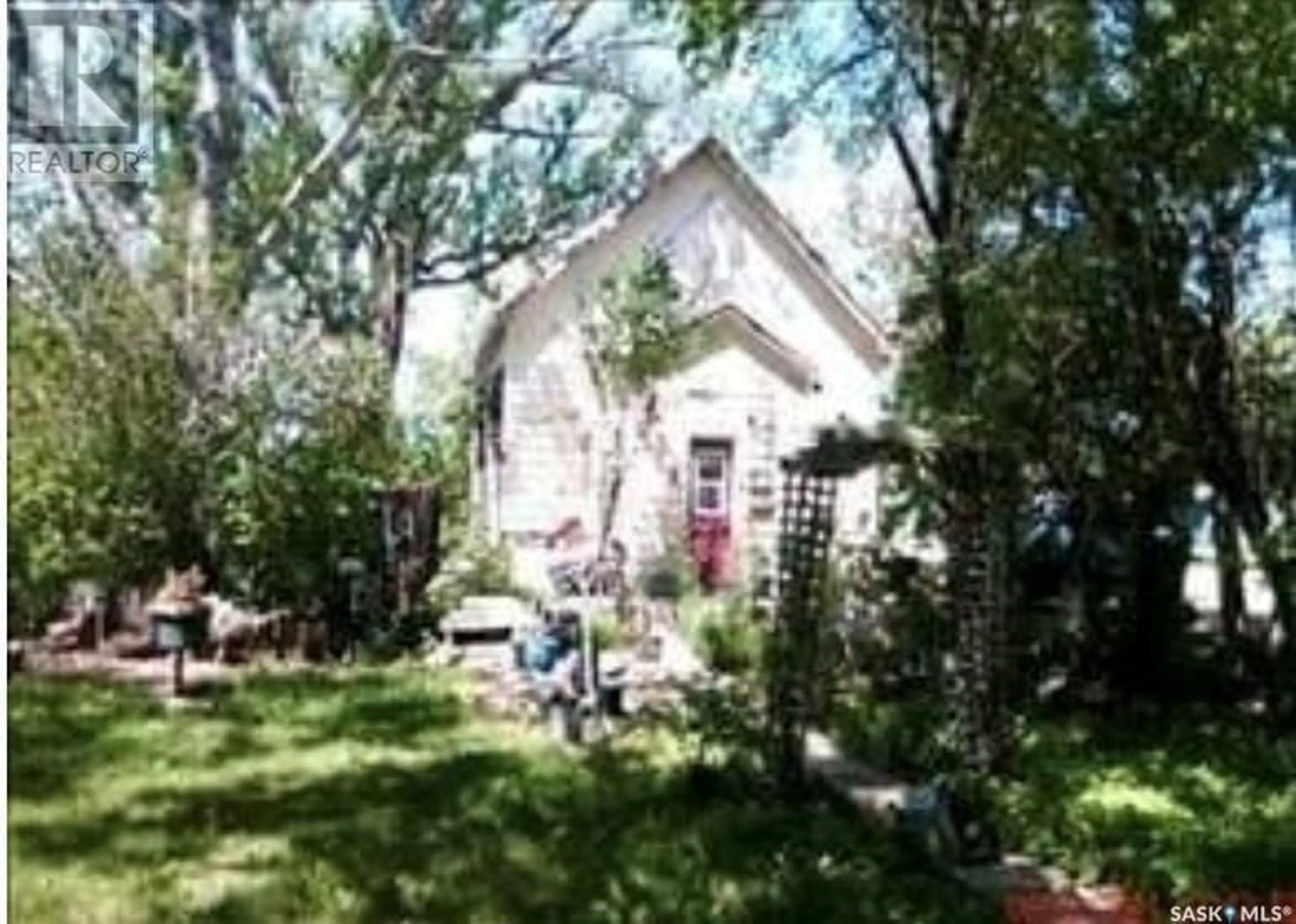 Frontside or backside of a home, the fenced backyard for 830 Main Street, Holdfast Saskatchewan S0G2H0