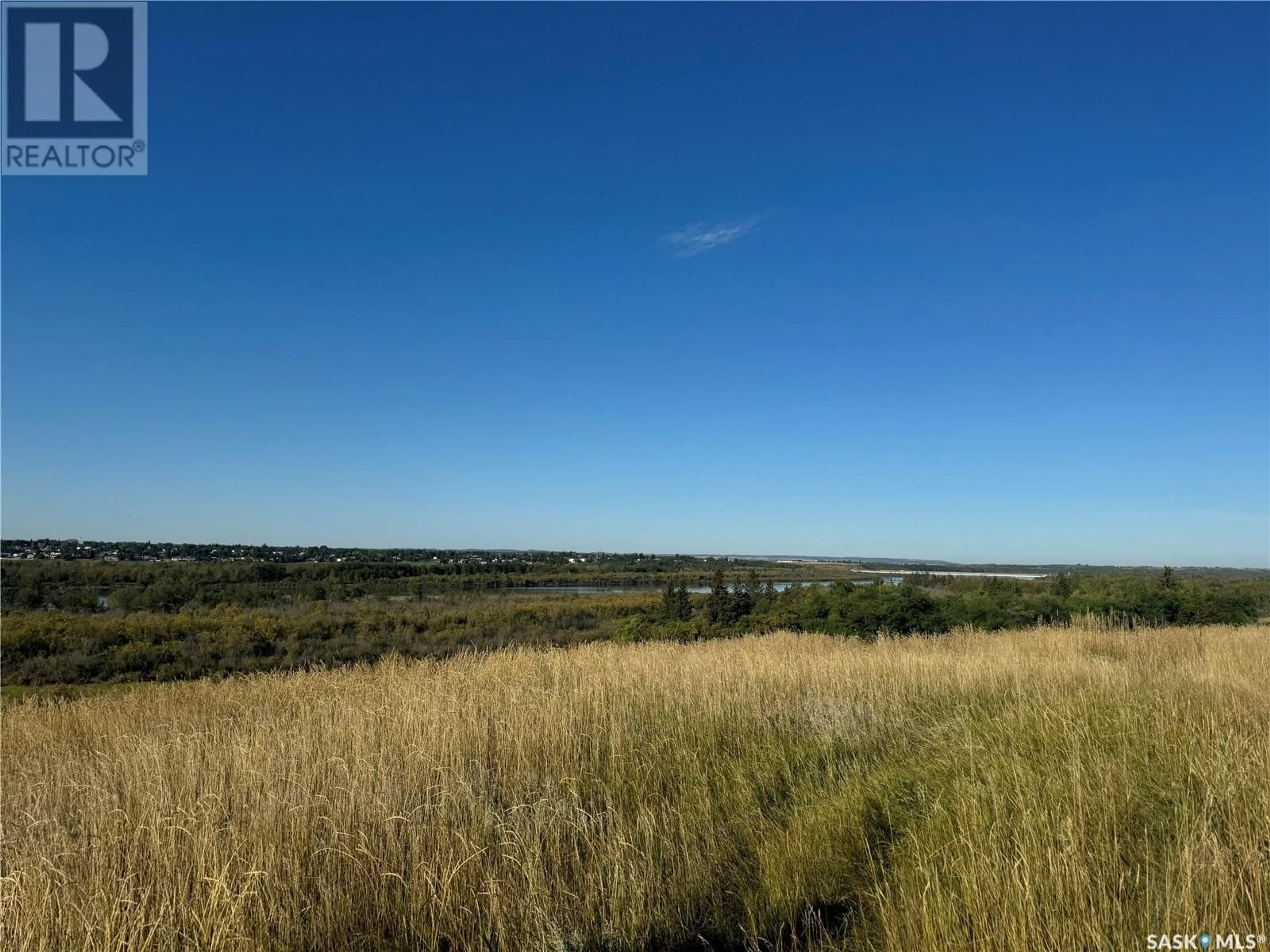 A pic from outside/outdoor area/front of a property/back of a property/a pic from drone, water/lake/river/ocean view for 22 Poundmaker TRAIL, North Battleford Saskatchewan S9A2X6