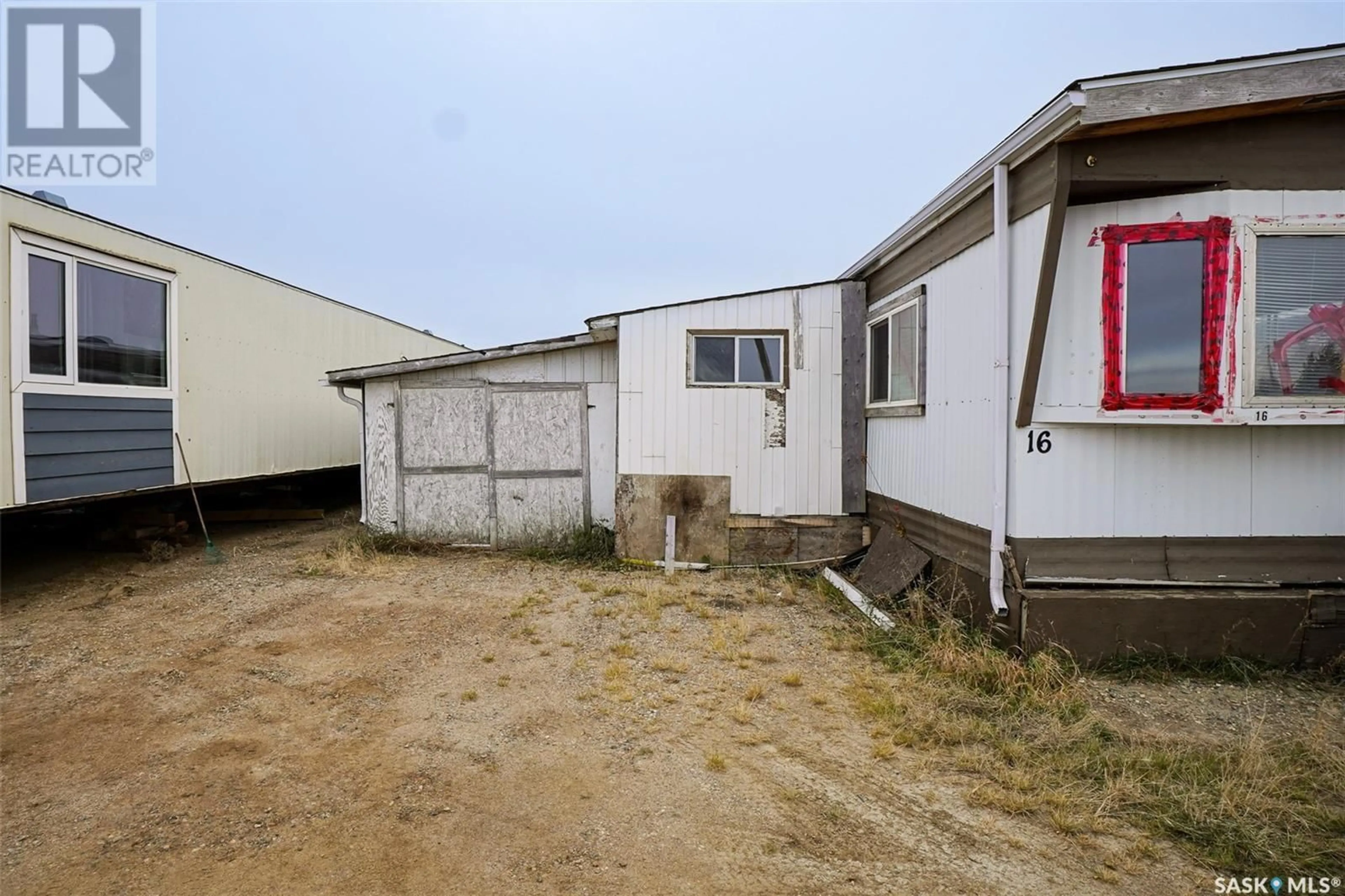 Frontside or backside of a home, the front or back of building for 16 401 Railway AVENUE E, Vanscoy Saskatchewan S0L3J0