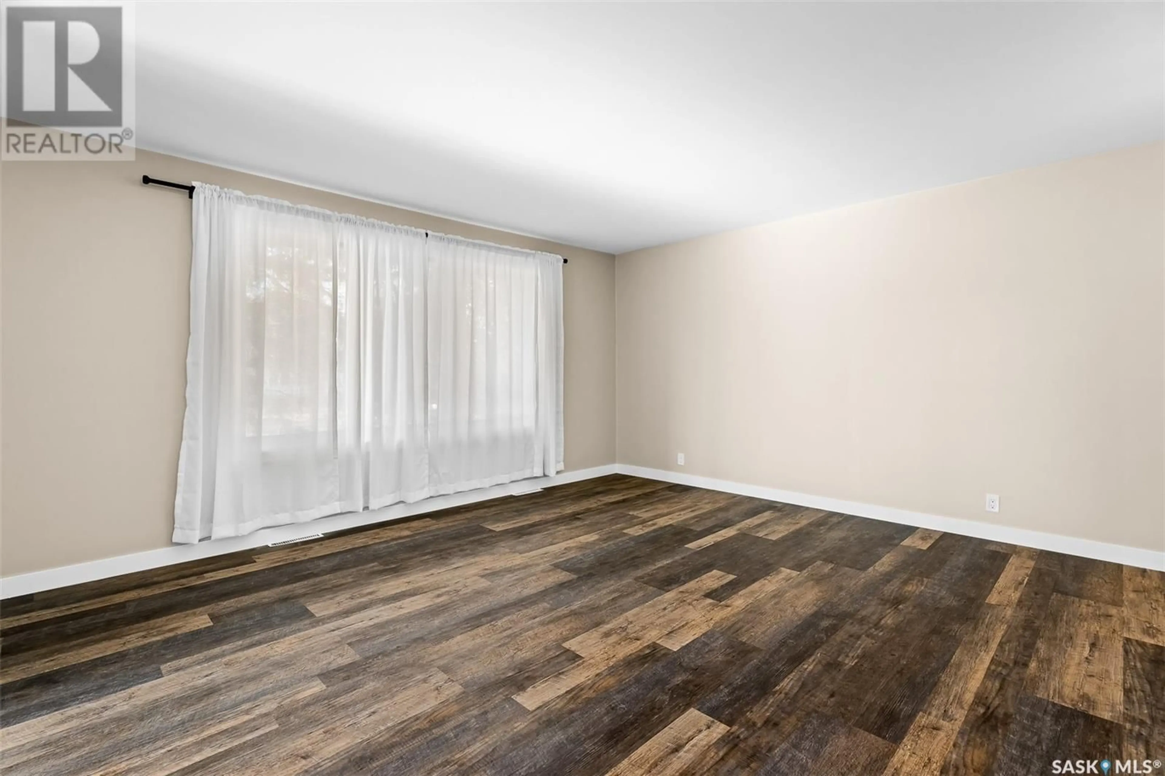 A pic of a room, wood floors for 873 4th AVENUE NE, Moose Jaw Saskatchewan S6H1H8