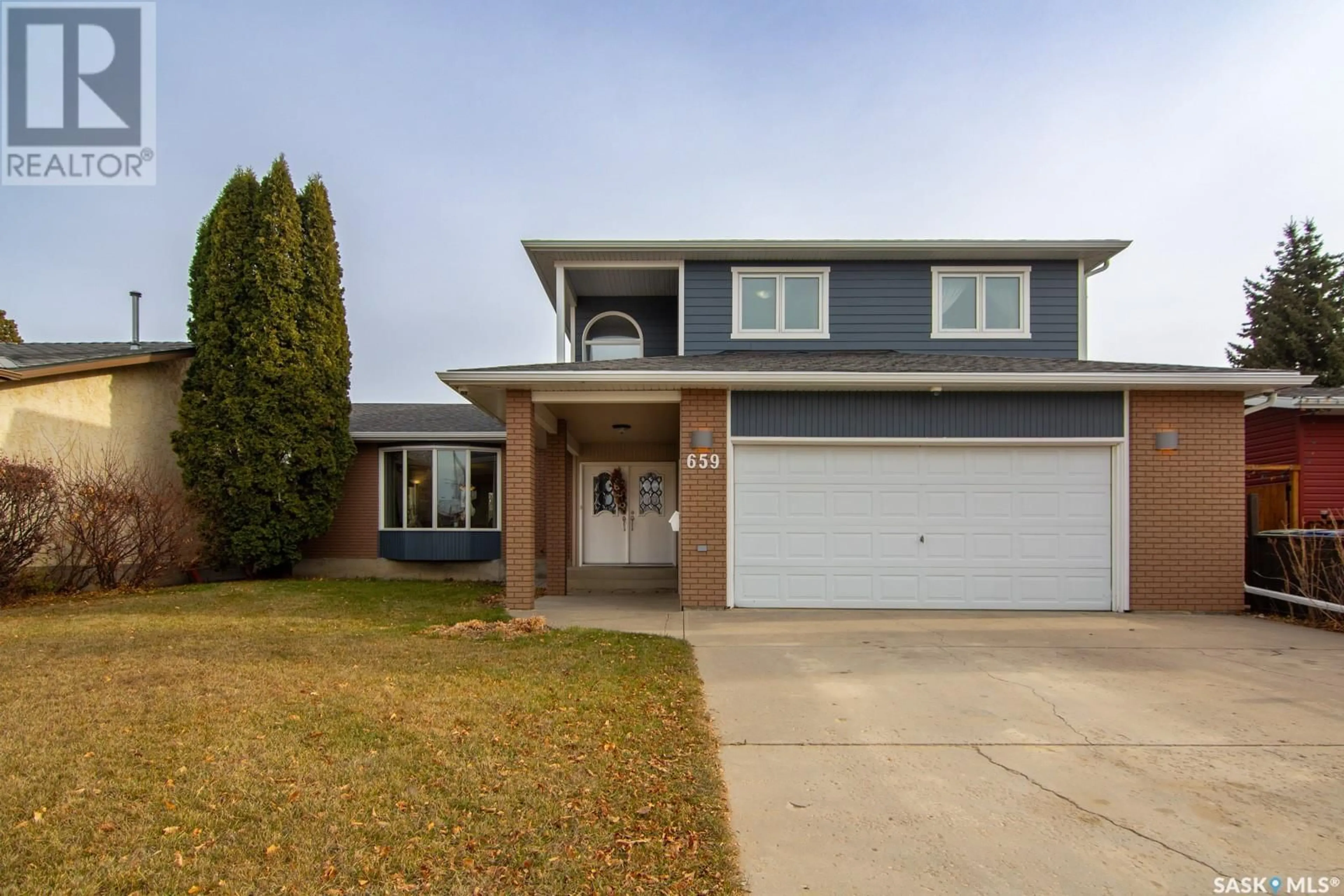 Frontside or backside of a home, the street view for 659 Candle WAY, Saskatoon Saskatchewan S7K5B2