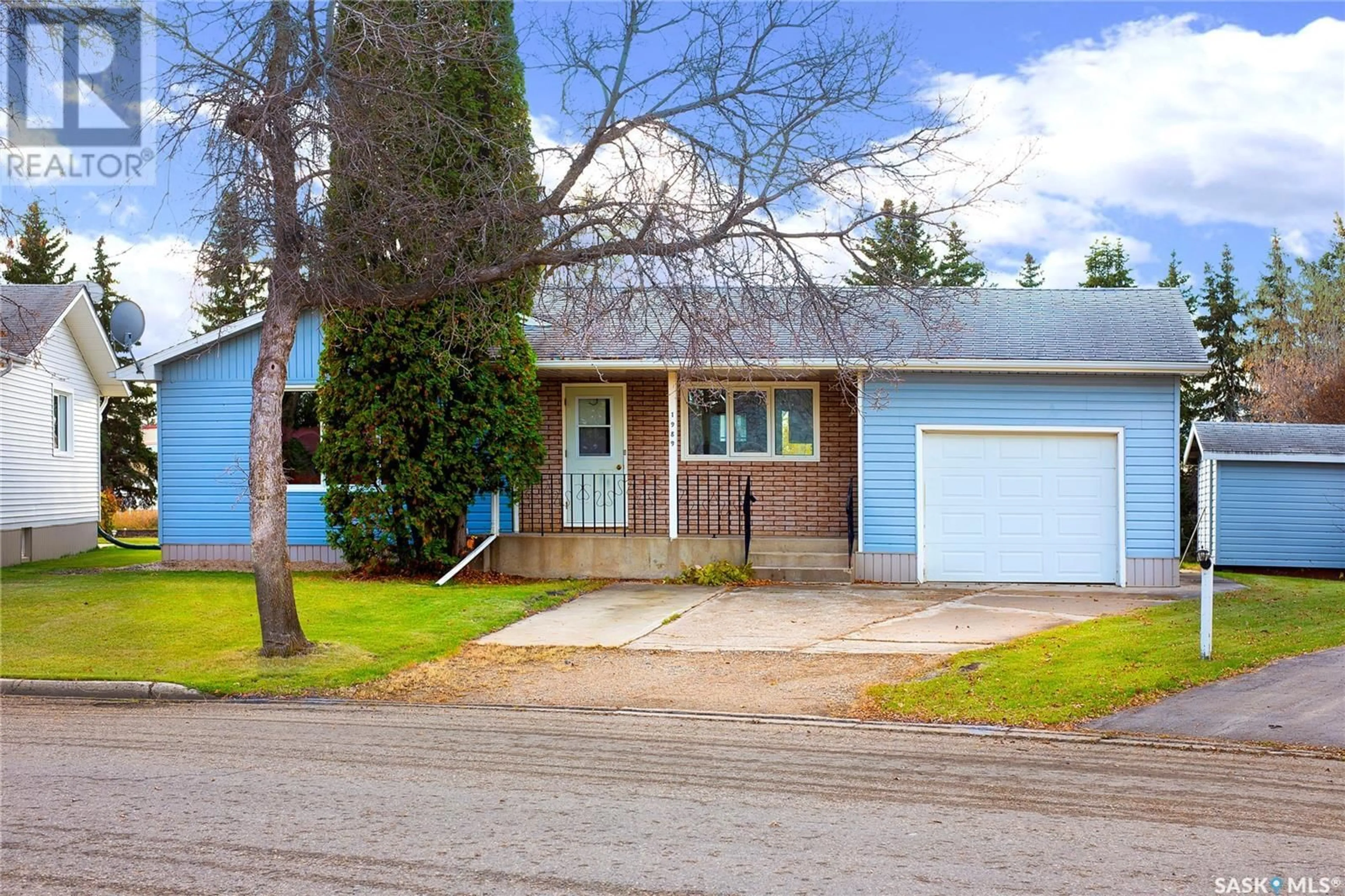 Frontside or backside of a home, cottage for 1989 New Market DRIVE, Tisdale Saskatchewan S0E1T0