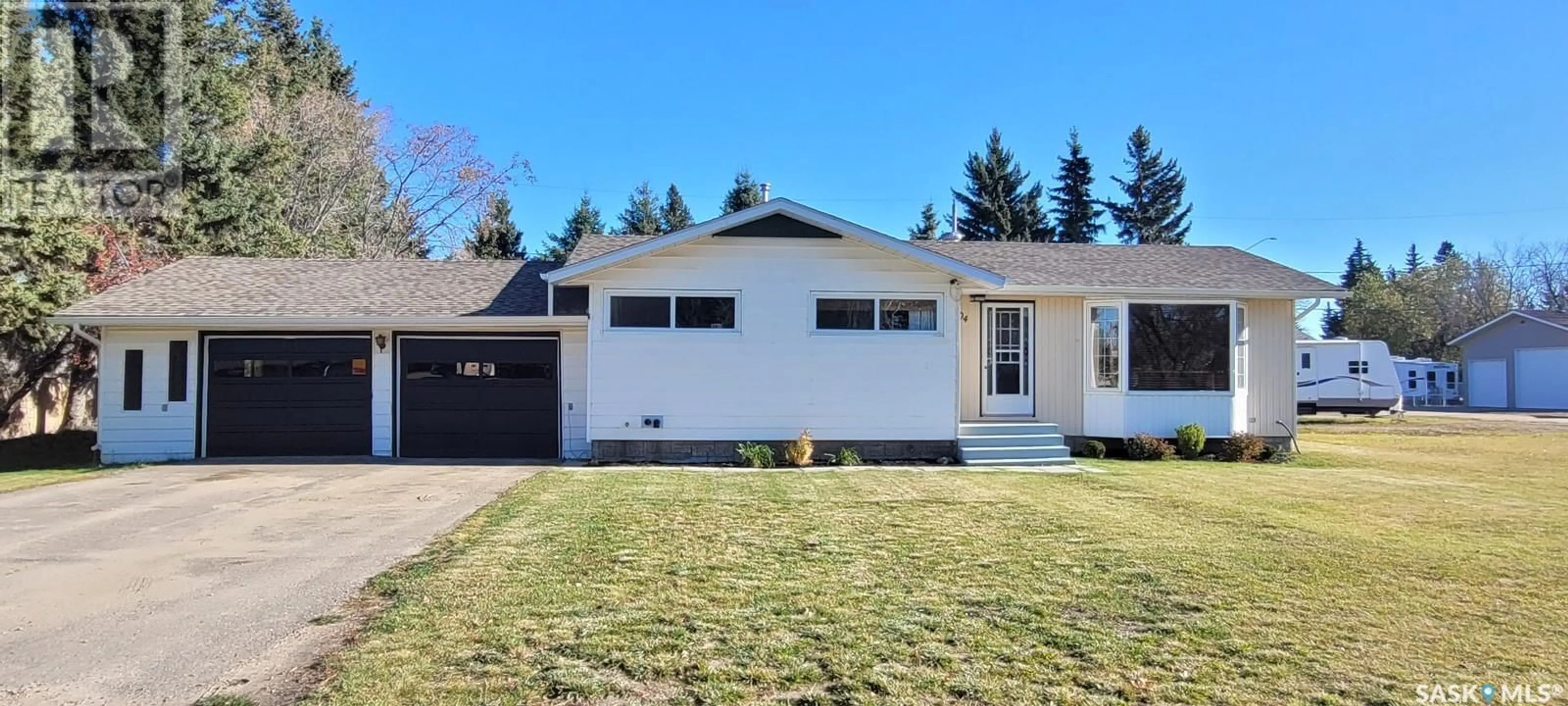 Home with vinyl exterior material, street for 704 RAILWAY AVENUE, Loon Lake Saskatchewan S0M1L0
