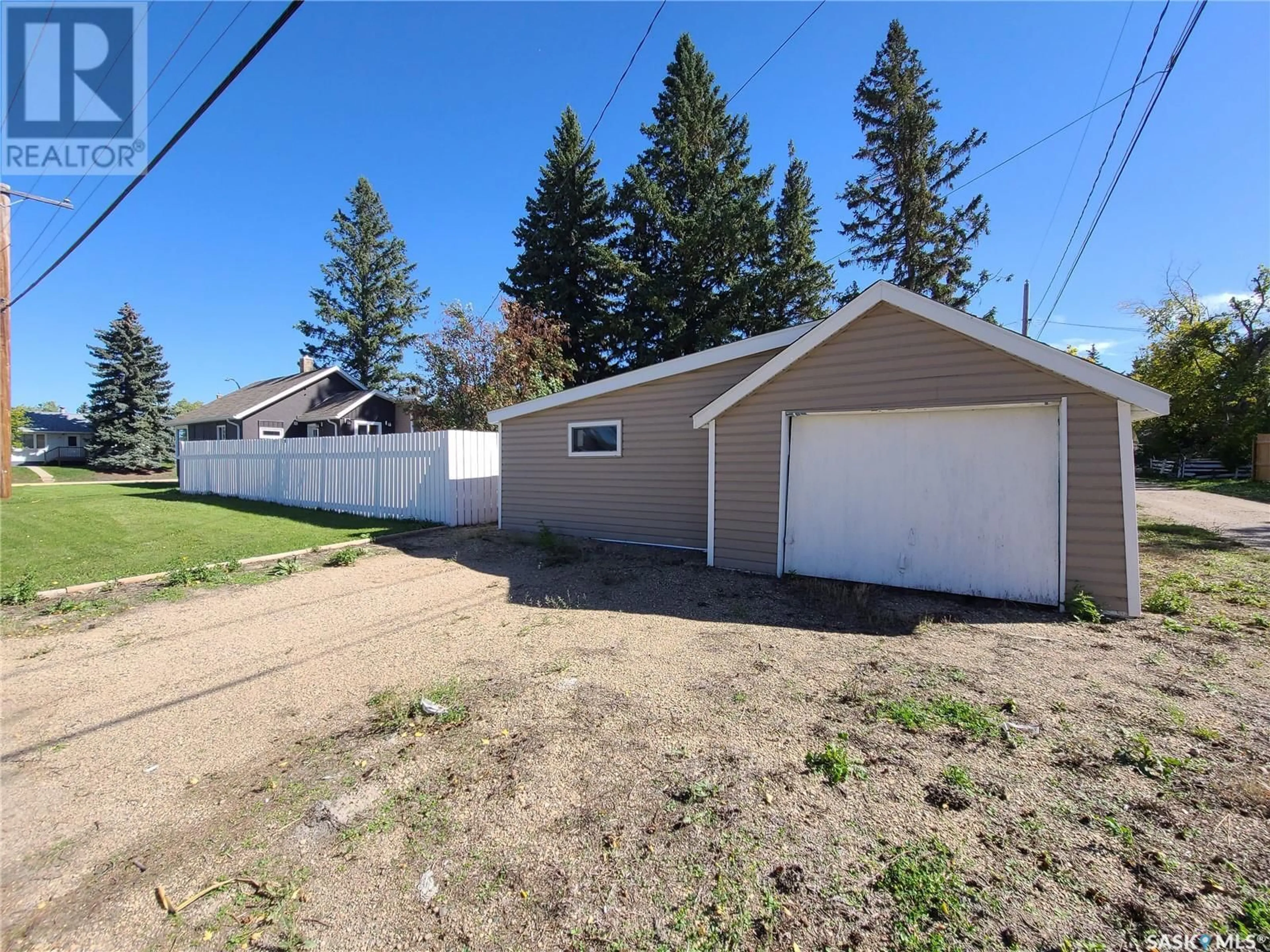 Frontside or backside of a home, the fenced backyard for 373 7th AVENUE W, Melville Saskatchewan S0A2P0