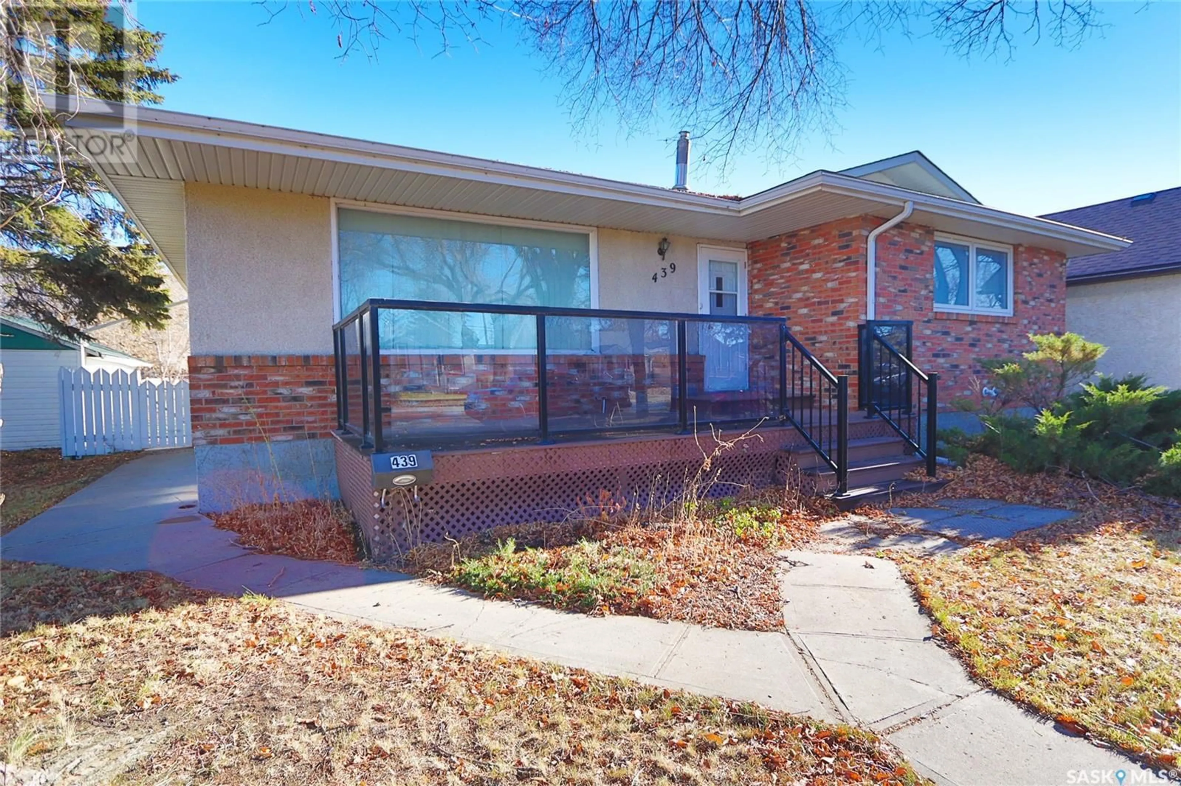 A pic from exterior of the house or condo, the fenced backyard for 439 Wascana STREET, Regina Saskatchewan S4R4J1