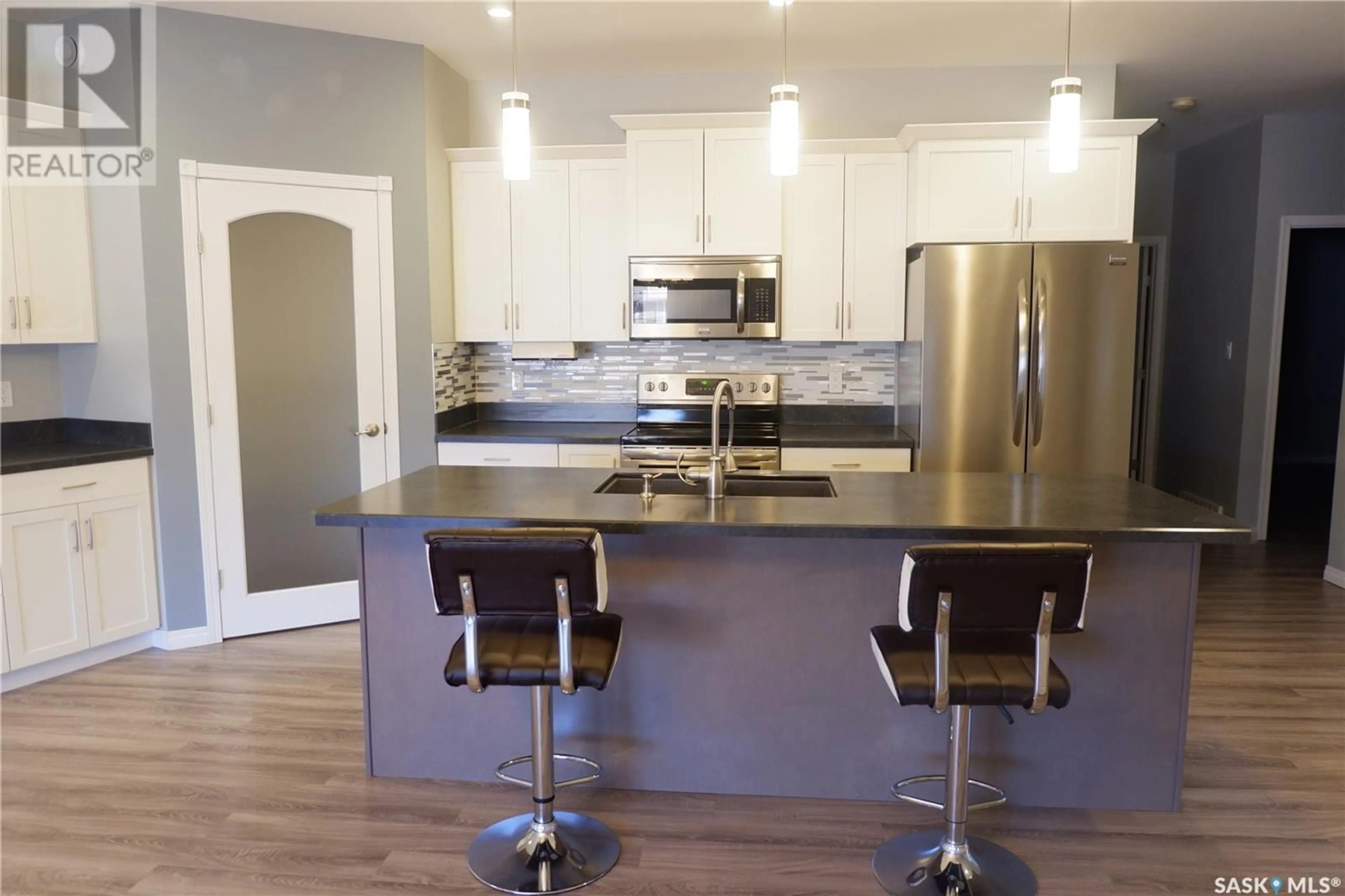 Contemporary kitchen, wood floors, cottage for 604 Centre STREET, Assiniboia Saskatchewan S0H0B0