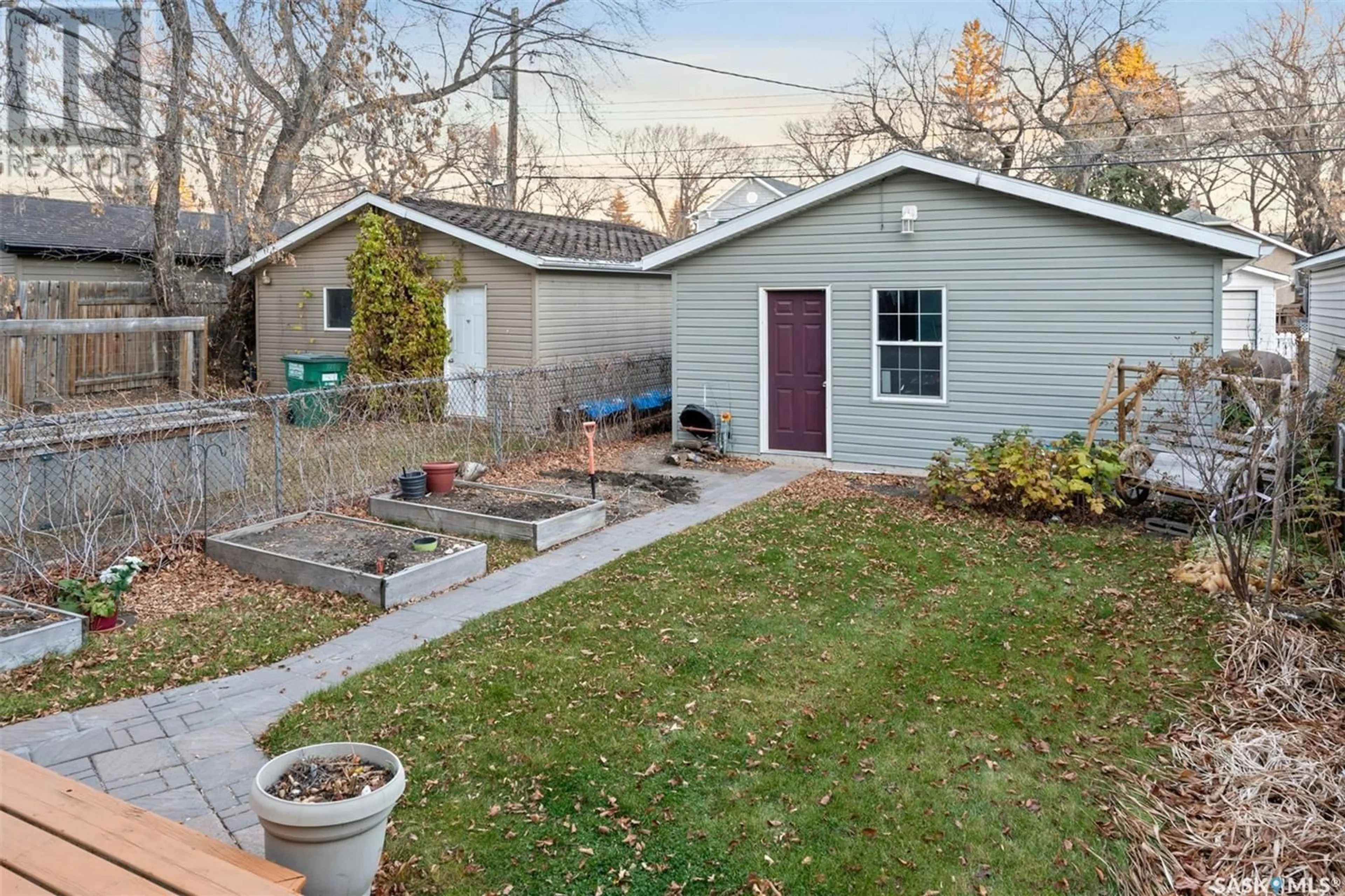 Frontside or backside of a home, the fenced backyard for 722 7th AVENUE N, Saskatoon Saskatchewan S7K2V4