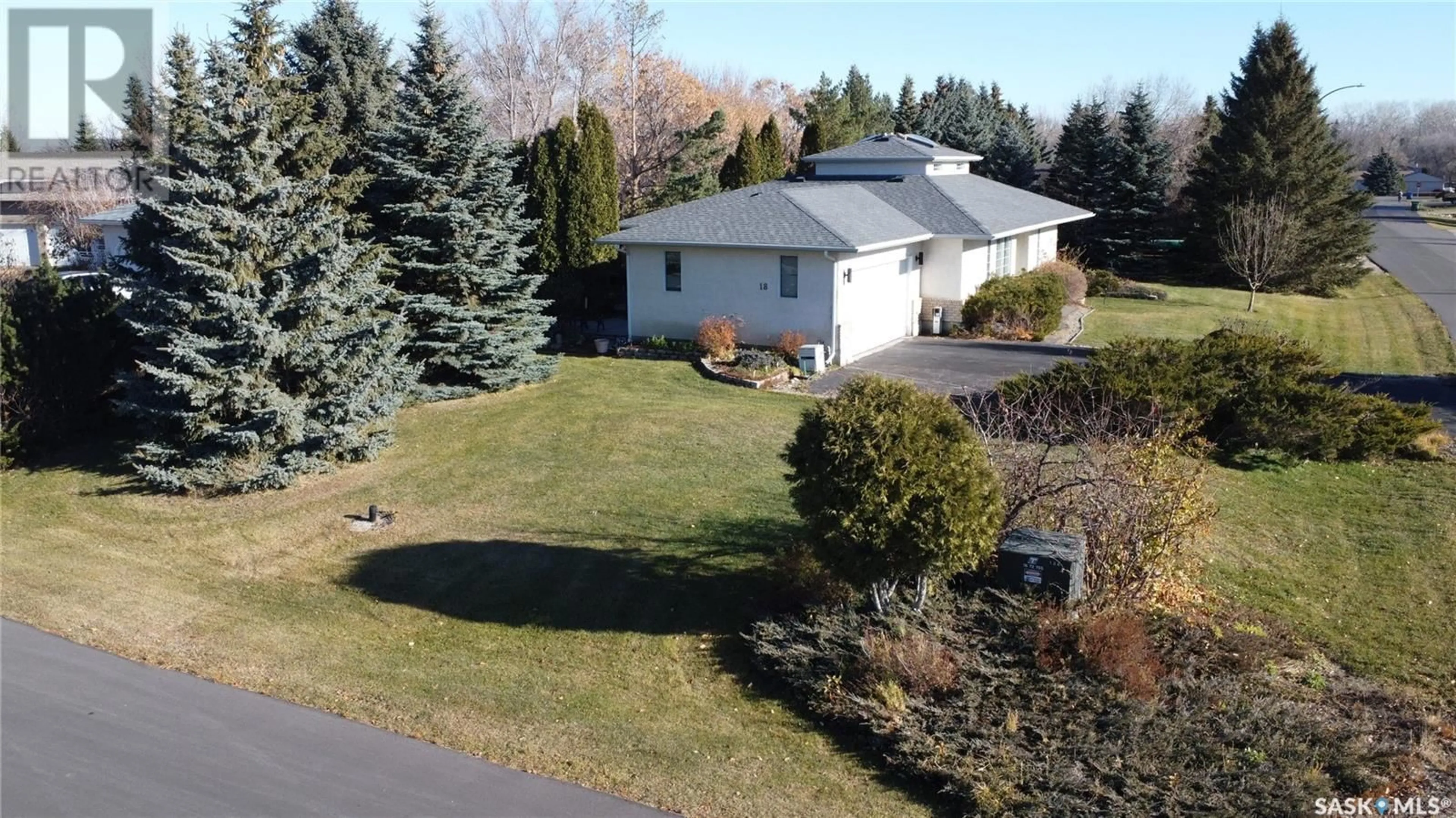 A pic from exterior of the house or condo, the fenced backyard for 18 PARK BAY, Emerald Park Saskatchewan S4L1B2