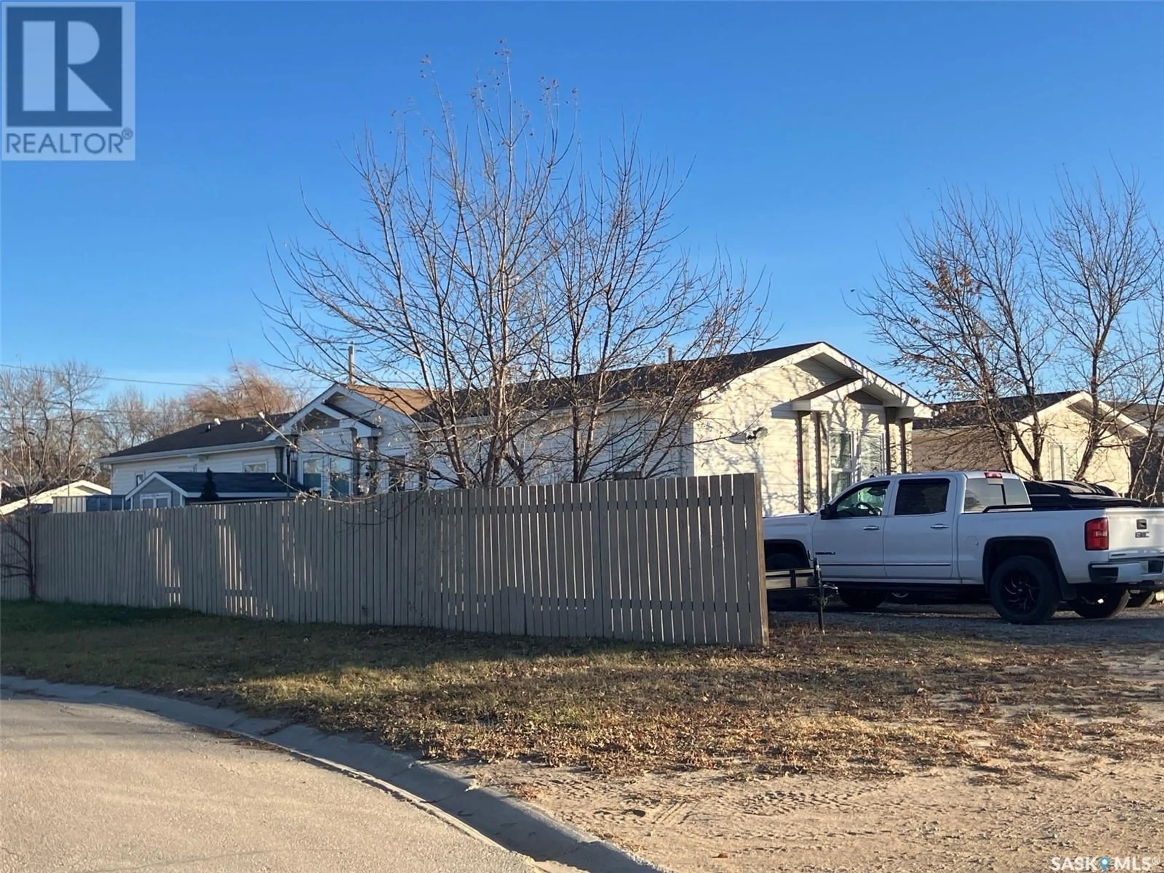 Frontside or backside of a home, the fenced backyard for 1201 3rd STREET W, Nipawin Saskatchewan S0E1E0