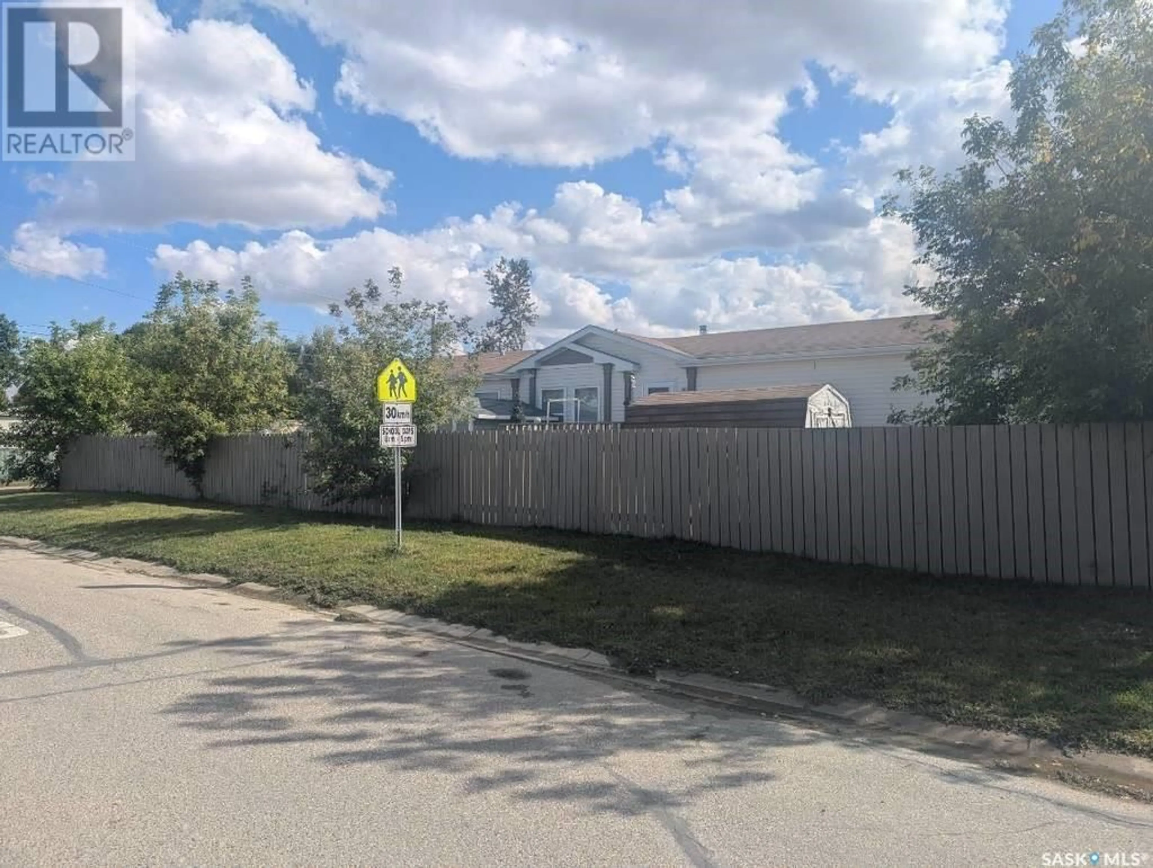 Frontside or backside of a home, the fenced backyard for 1201 3rd STREET W, Nipawin Saskatchewan S0E1E0