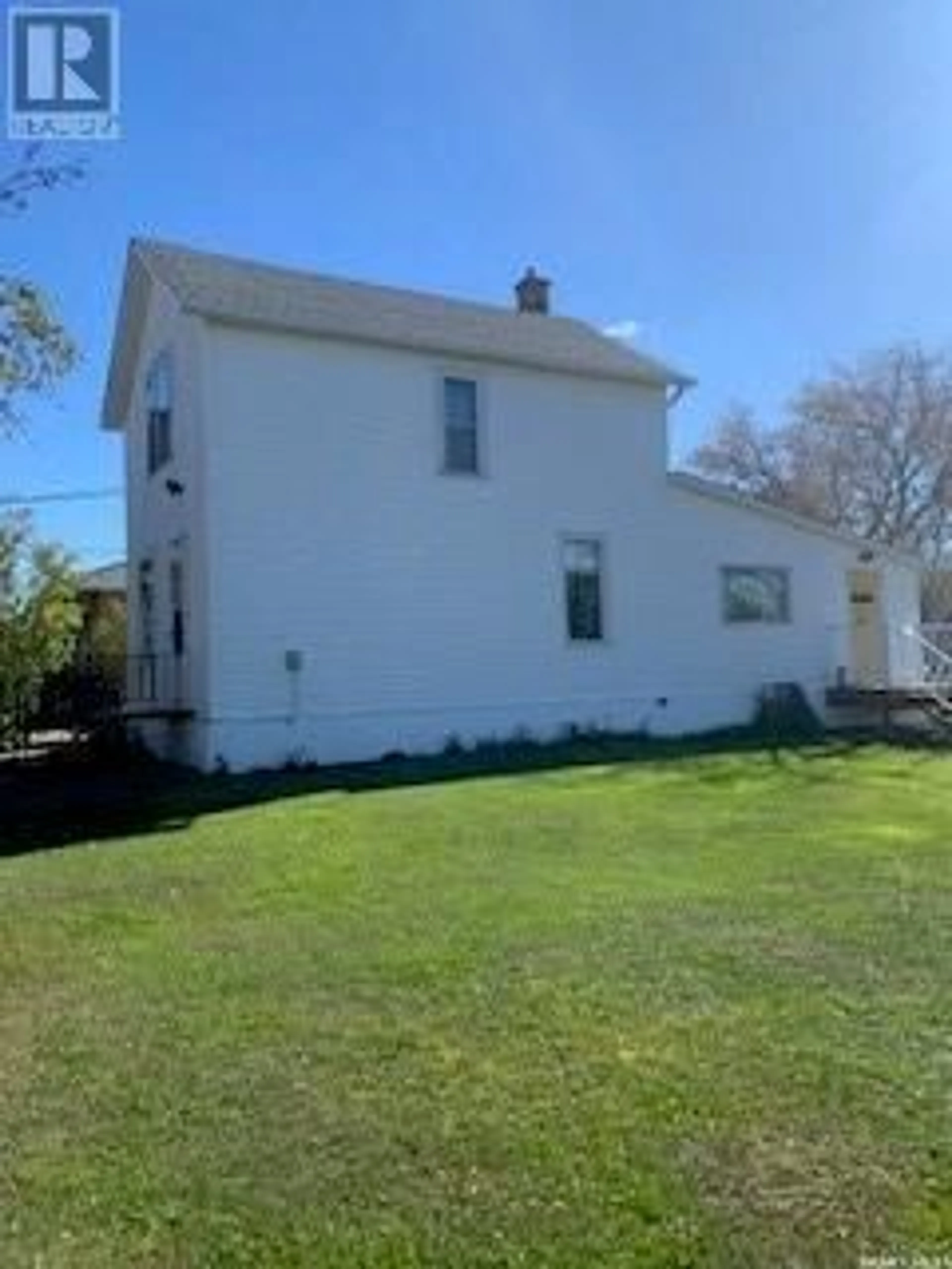 Frontside or backside of a home, the fenced backyard for 601 Walsh AVENUE, Oxbow Saskatchewan S0C2B0