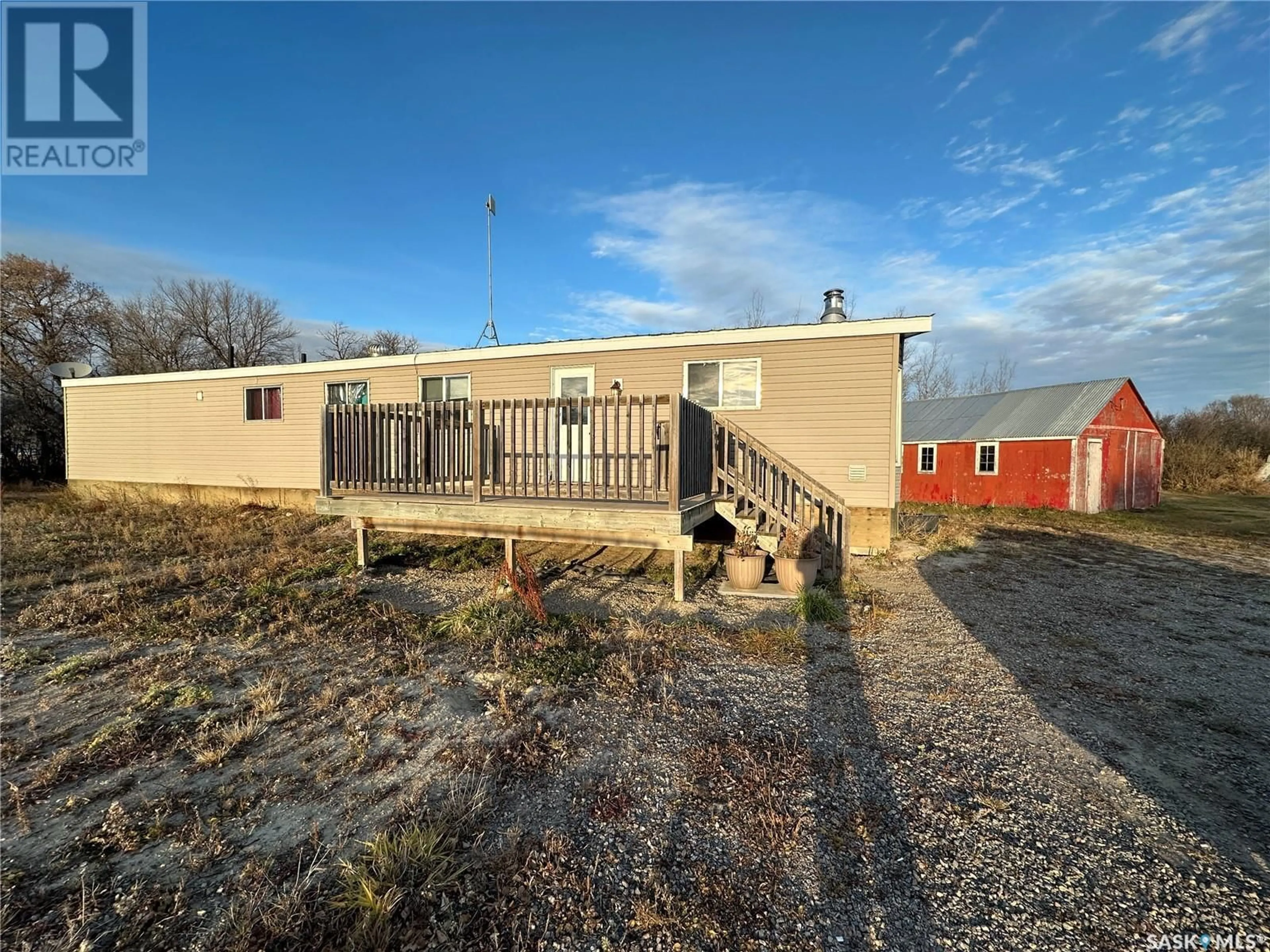 Frontside or backside of a home, the fenced backyard for Bauer Acreage, St. Peter RM No. 369 Saskatchewan S0K3X0