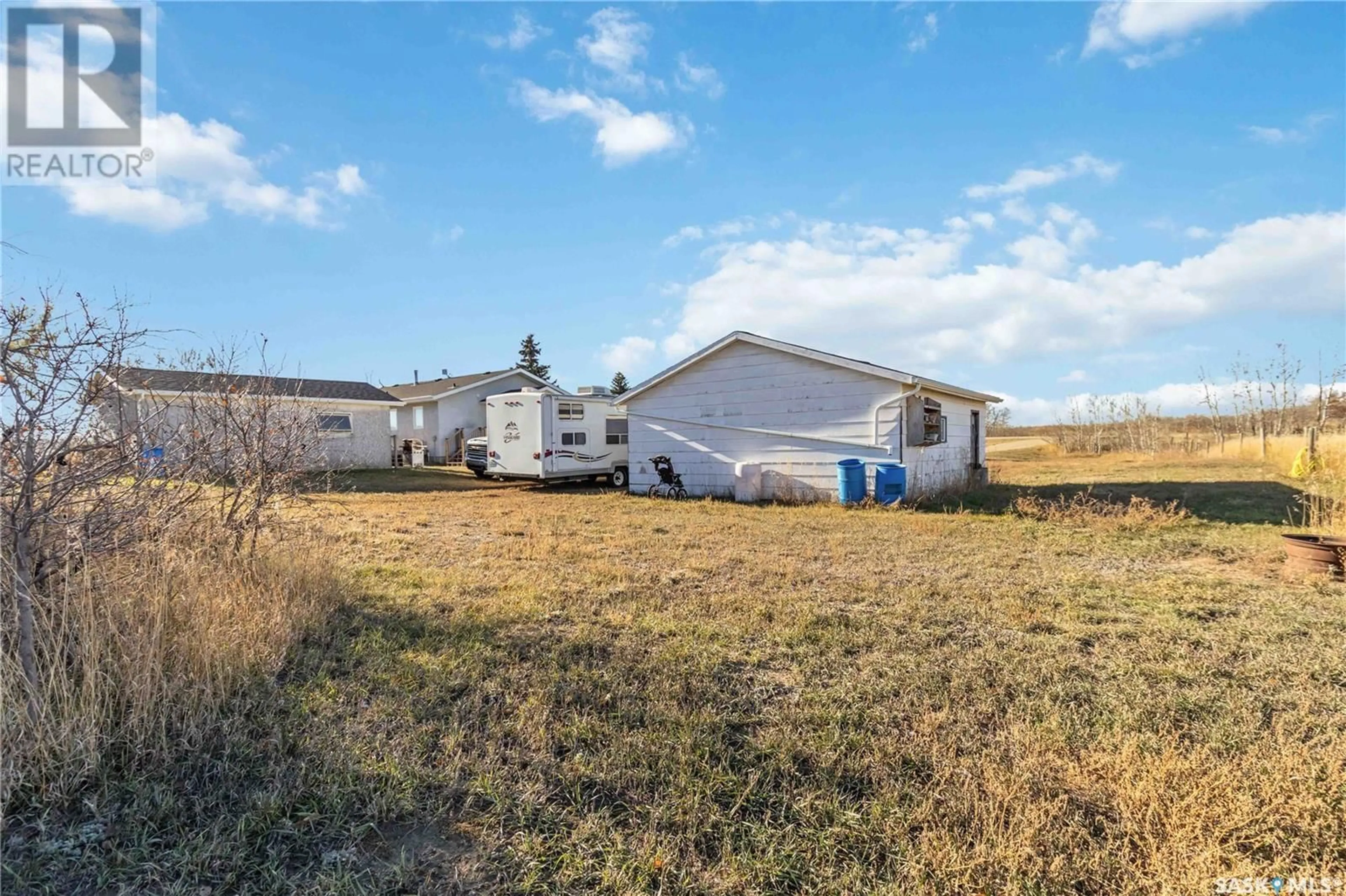 A pic from exterior of the house or condo, the fenced backyard for NW01-35-08-W3 Prairie Lane ROAD, Vanscoy Rm No. 345 Saskatchewan S0L3J0