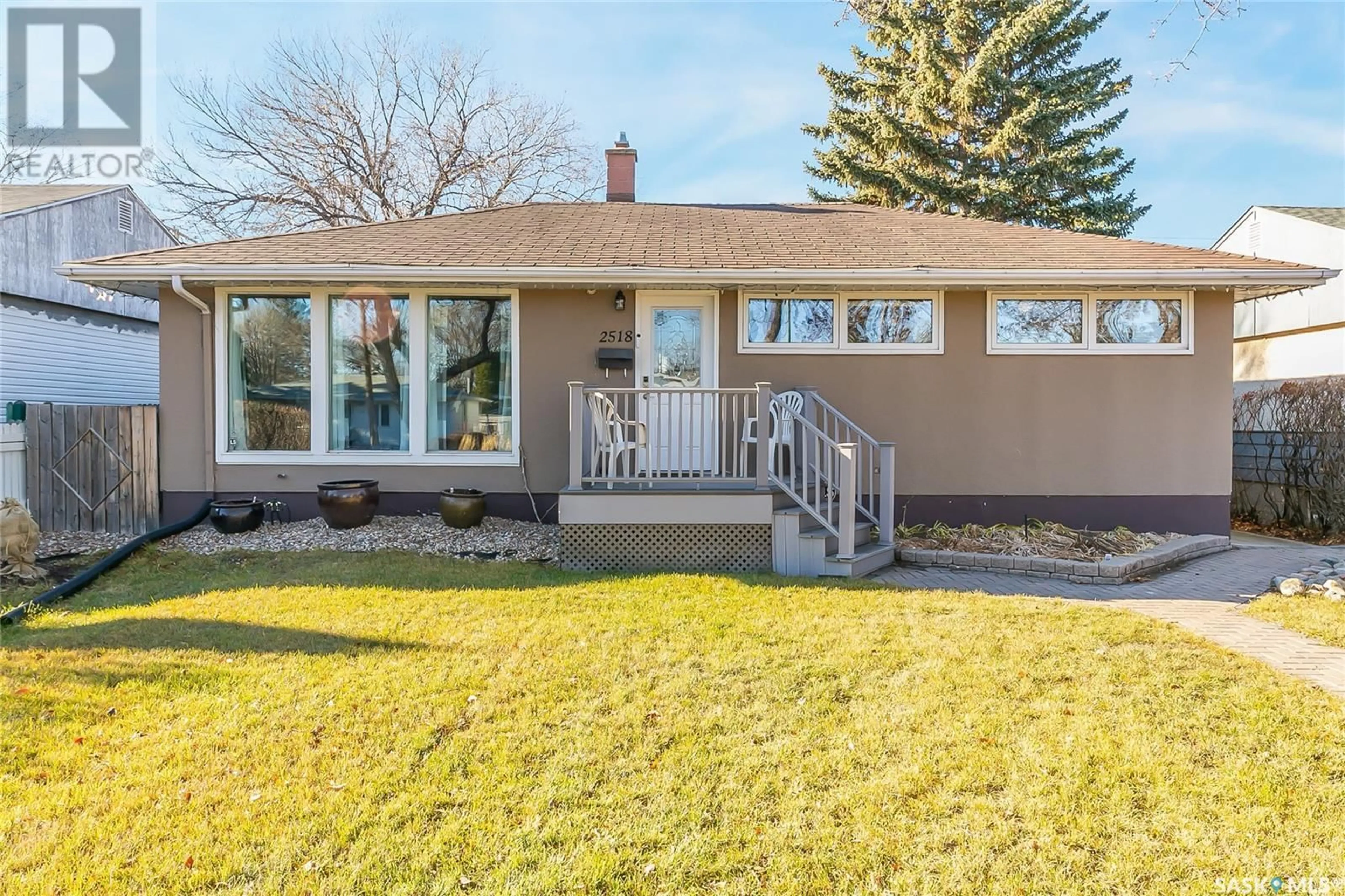 Frontside or backside of a home, the fenced backyard for 2518 Edward STREET, Regina Saskatchewan S4S0M8