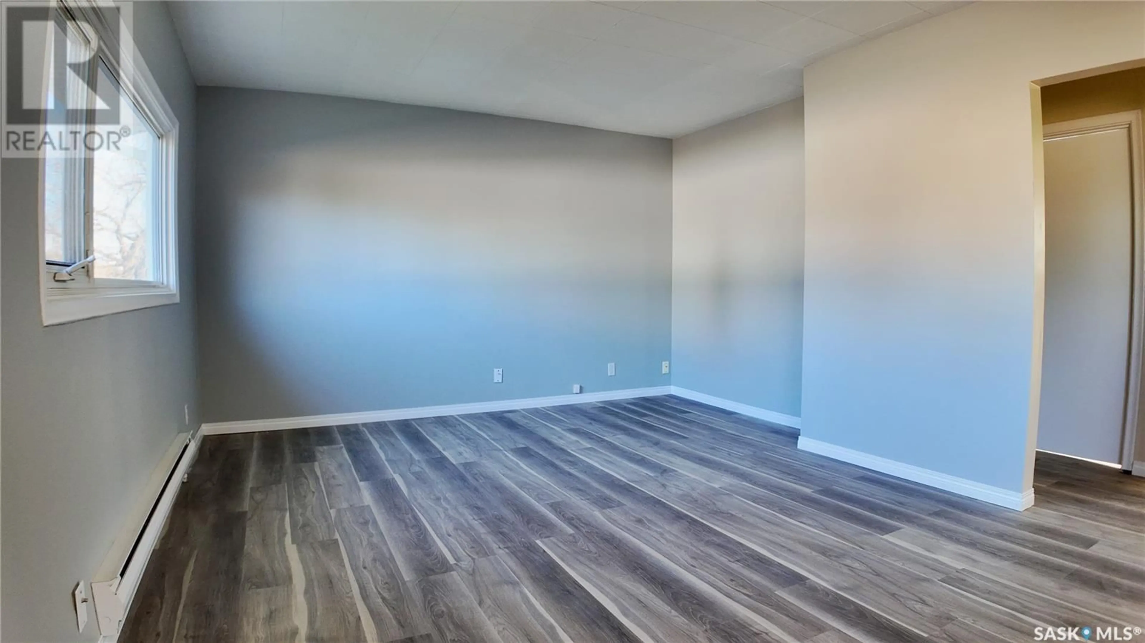 A pic of a room, wood floors for A & B 892 111th STREET, North Battleford Saskatchewan S9A2K1