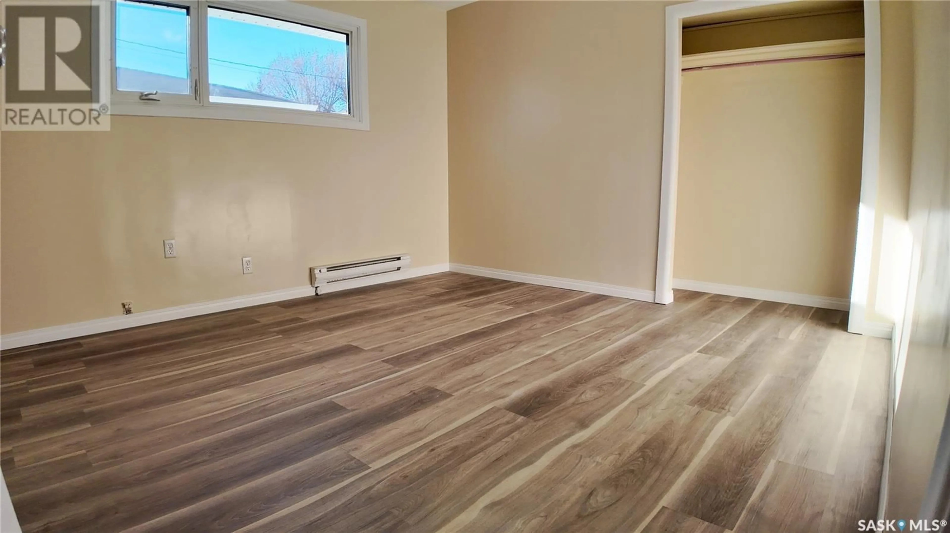 A pic of a room, wood floors for A & B 892 111th STREET, North Battleford Saskatchewan S9A2K1