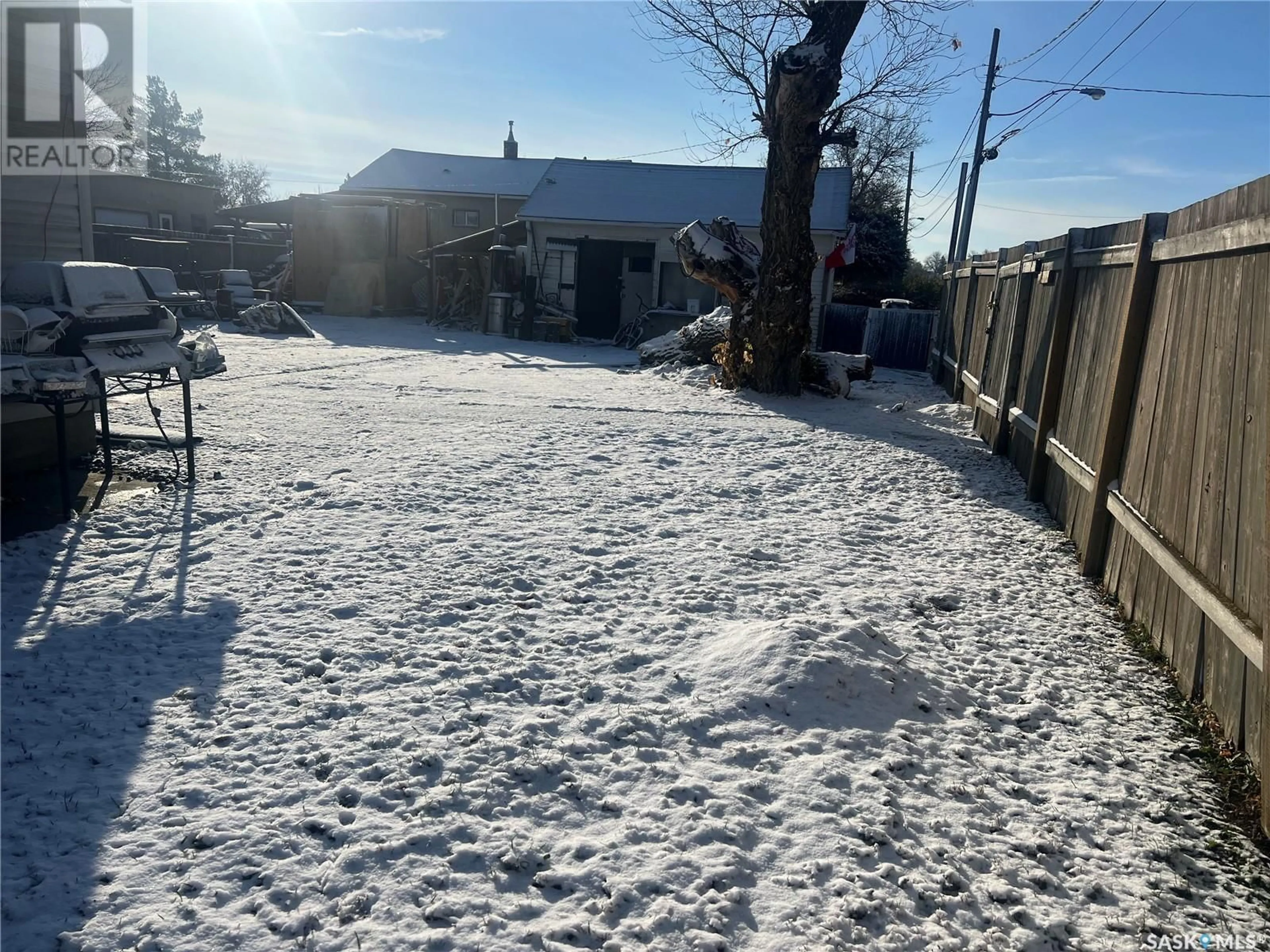 Frontside or backside of a home, the fenced backyard for 1306 South Railway STREET E, Swift Current Saskatchewan S9H3B8