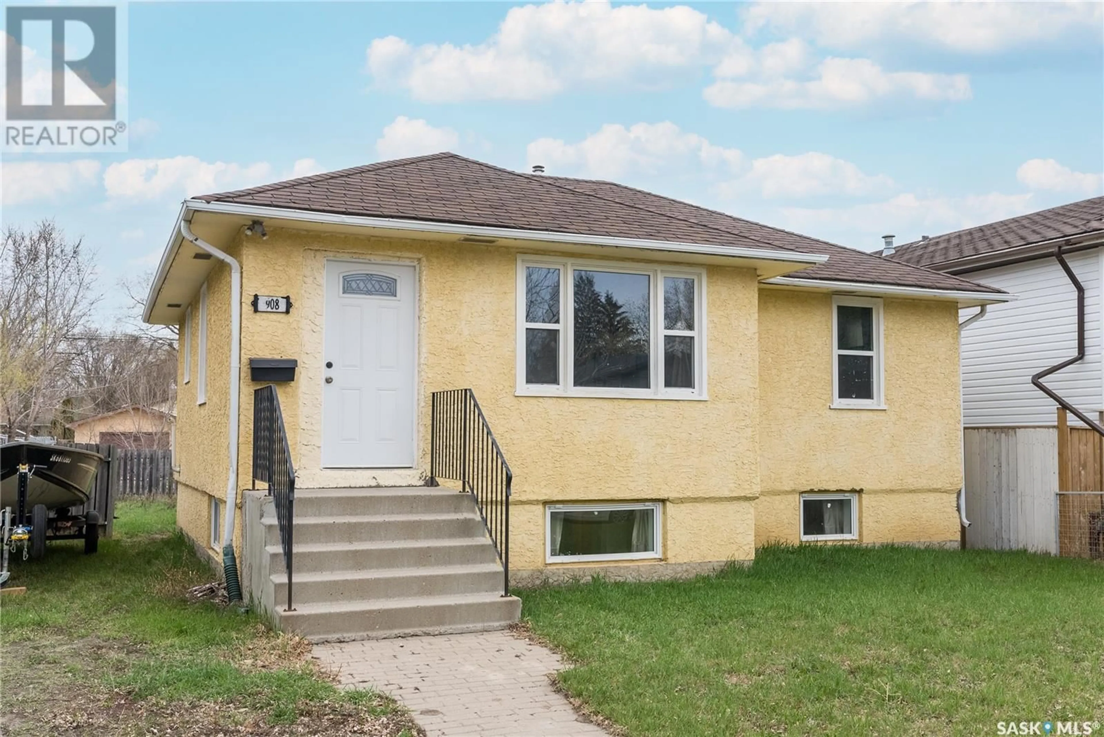 Frontside or backside of a home, the front or back of building for 908 L AVENUE S, Saskatoon Saskatchewan S7M2J3