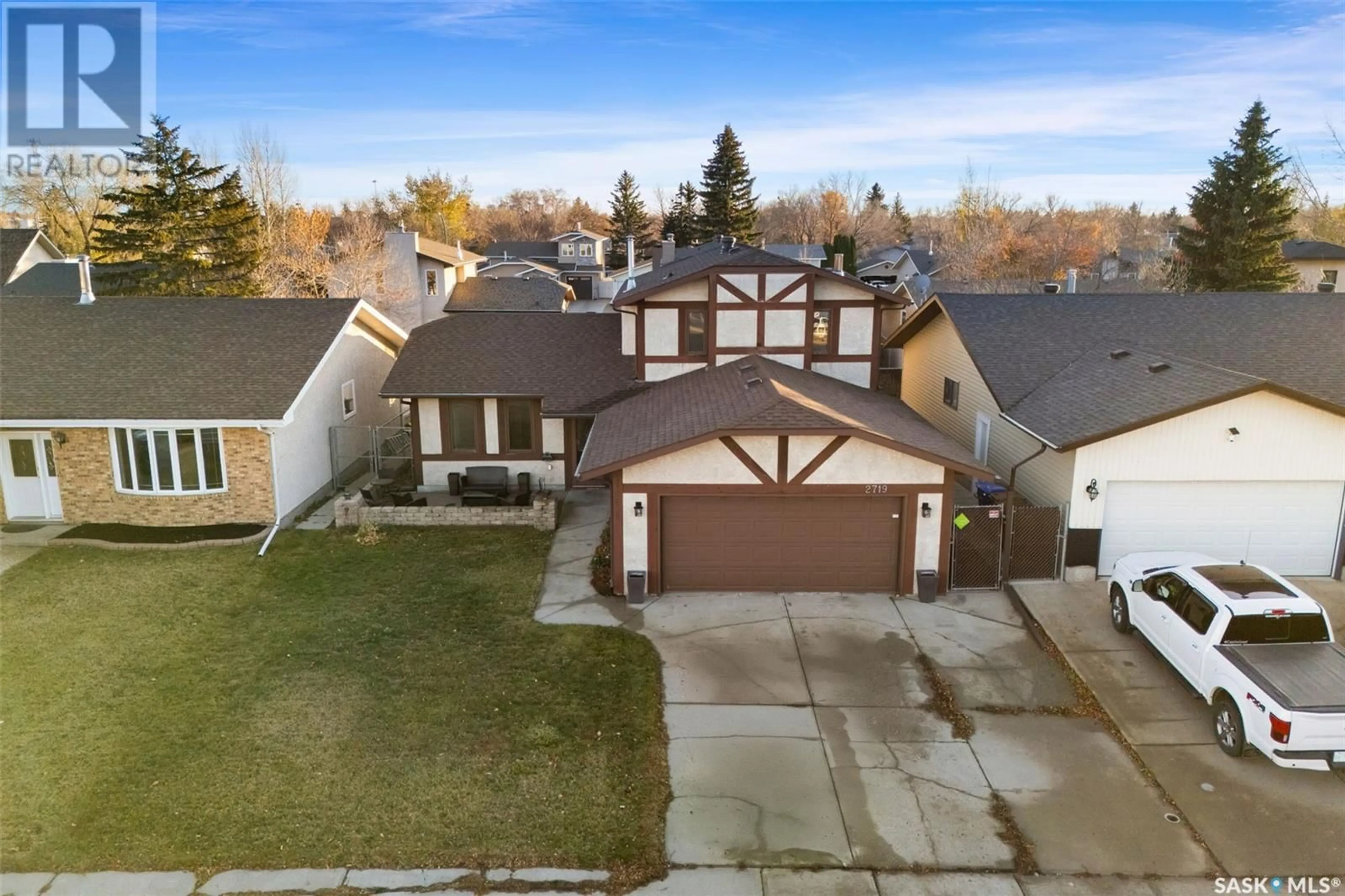 Frontside or backside of a home, the fenced backyard for 2719 Goodfellow ROAD, Regina Saskatchewan S4R8J9