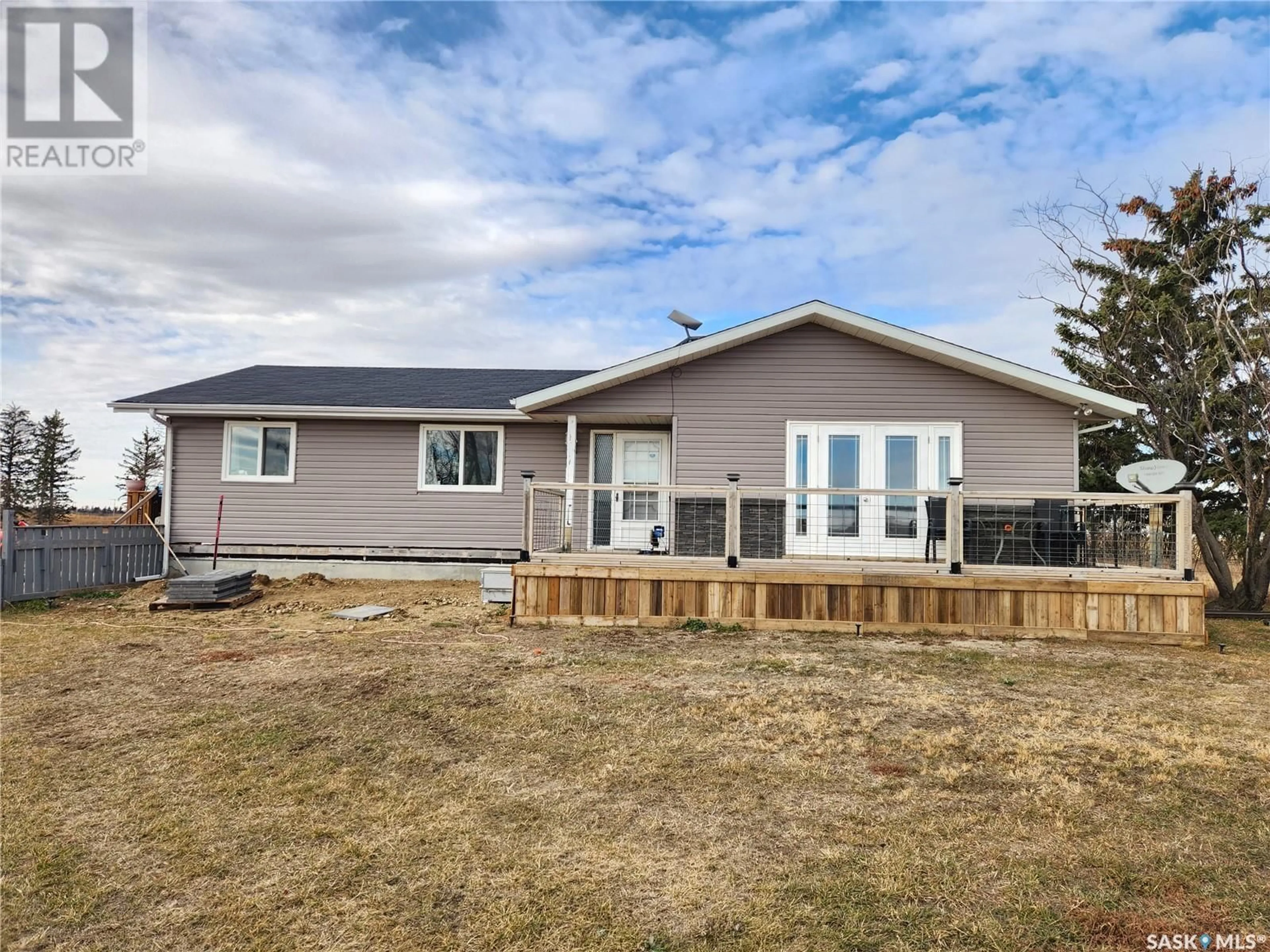 Frontside or backside of a home, the fenced backyard for Callaghan Acreage, Key West Rm No. 70 Saskatchewan S0C1Y0