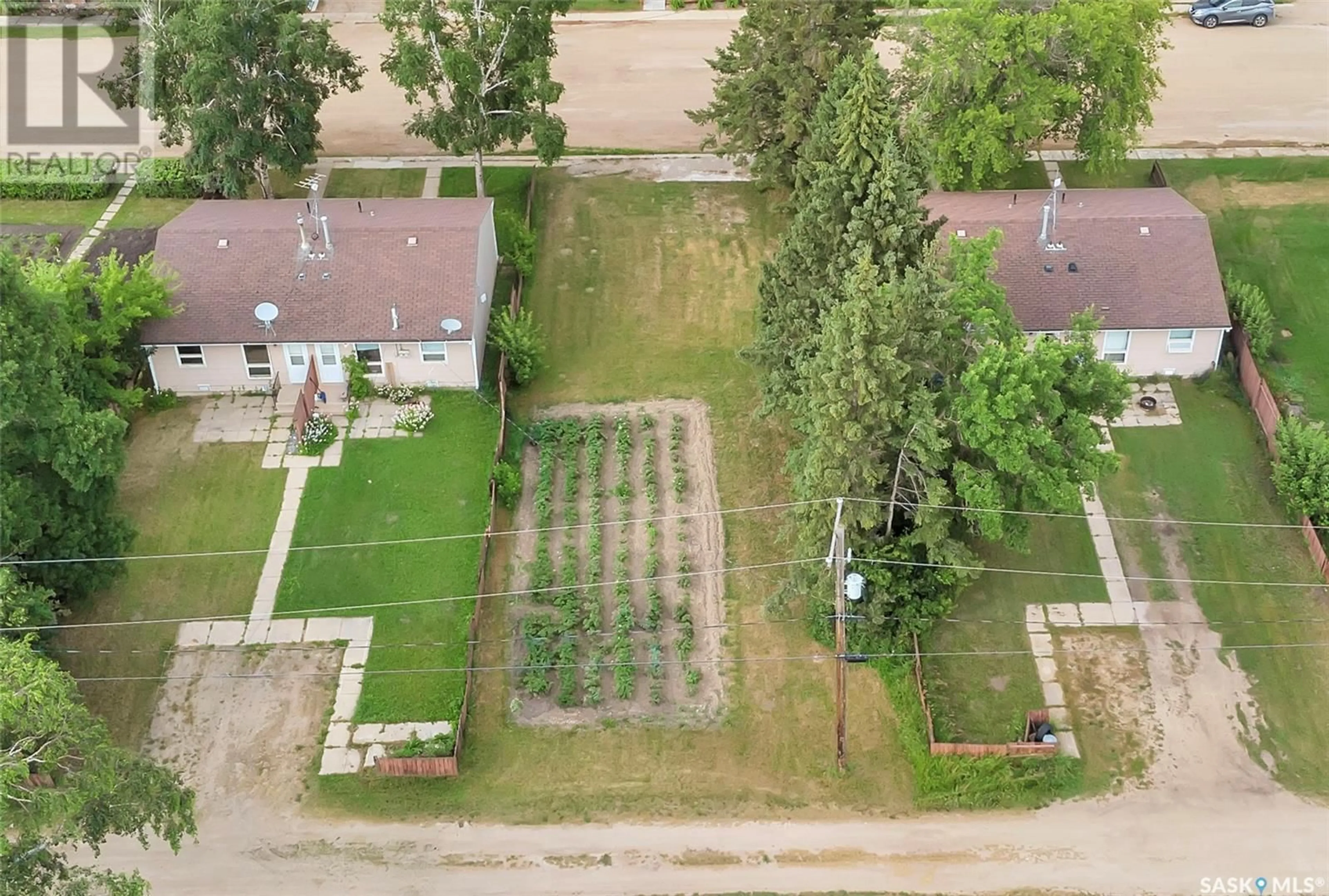 Patio, the fenced backyard for 108/110 1st AVENUE N, Hyas Saskatchewan S0A1K0