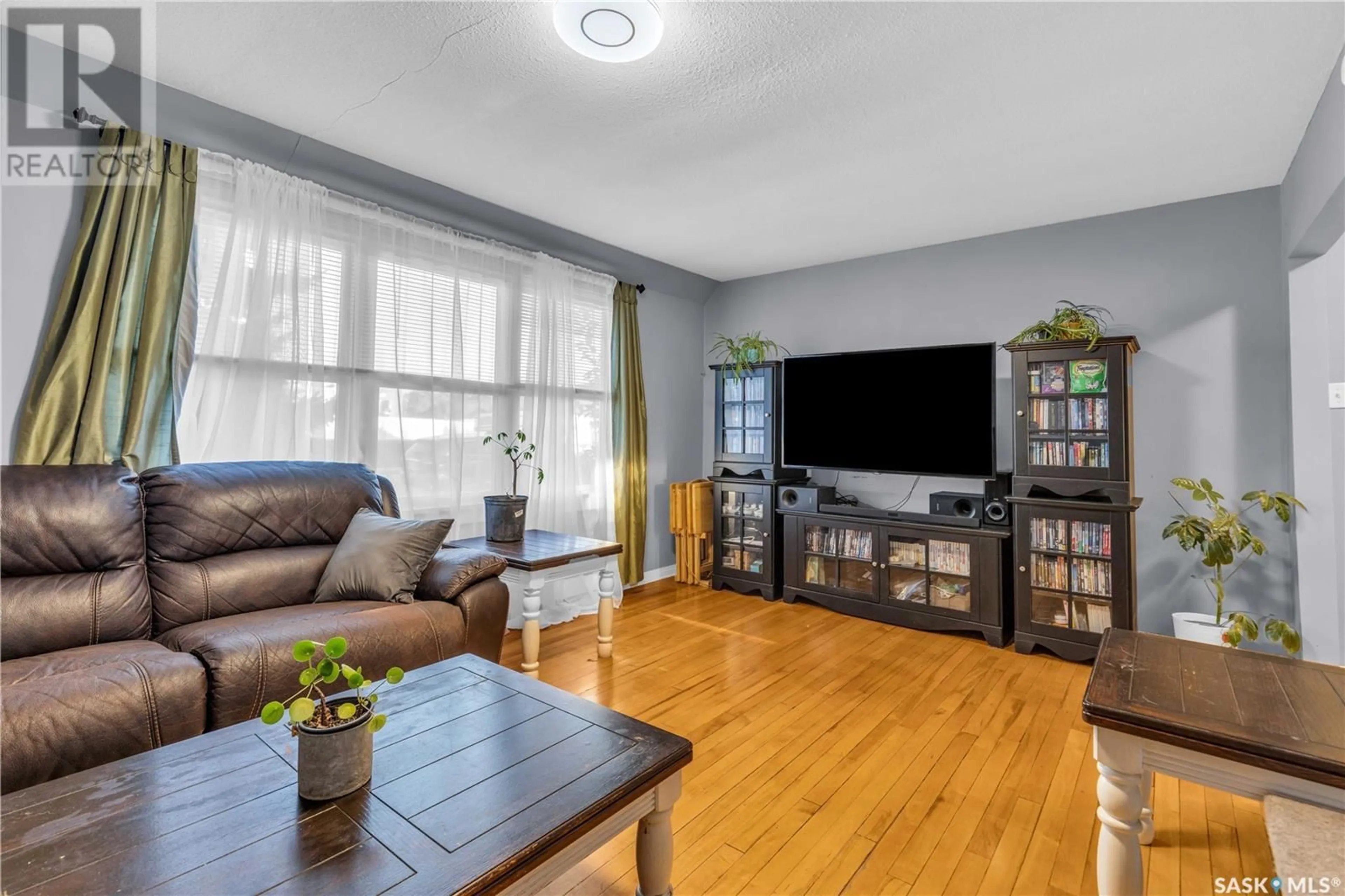 Living room, wood floors for 12 210 Camponi PLACE, Saskatoon Saskatchewan S7M1J7