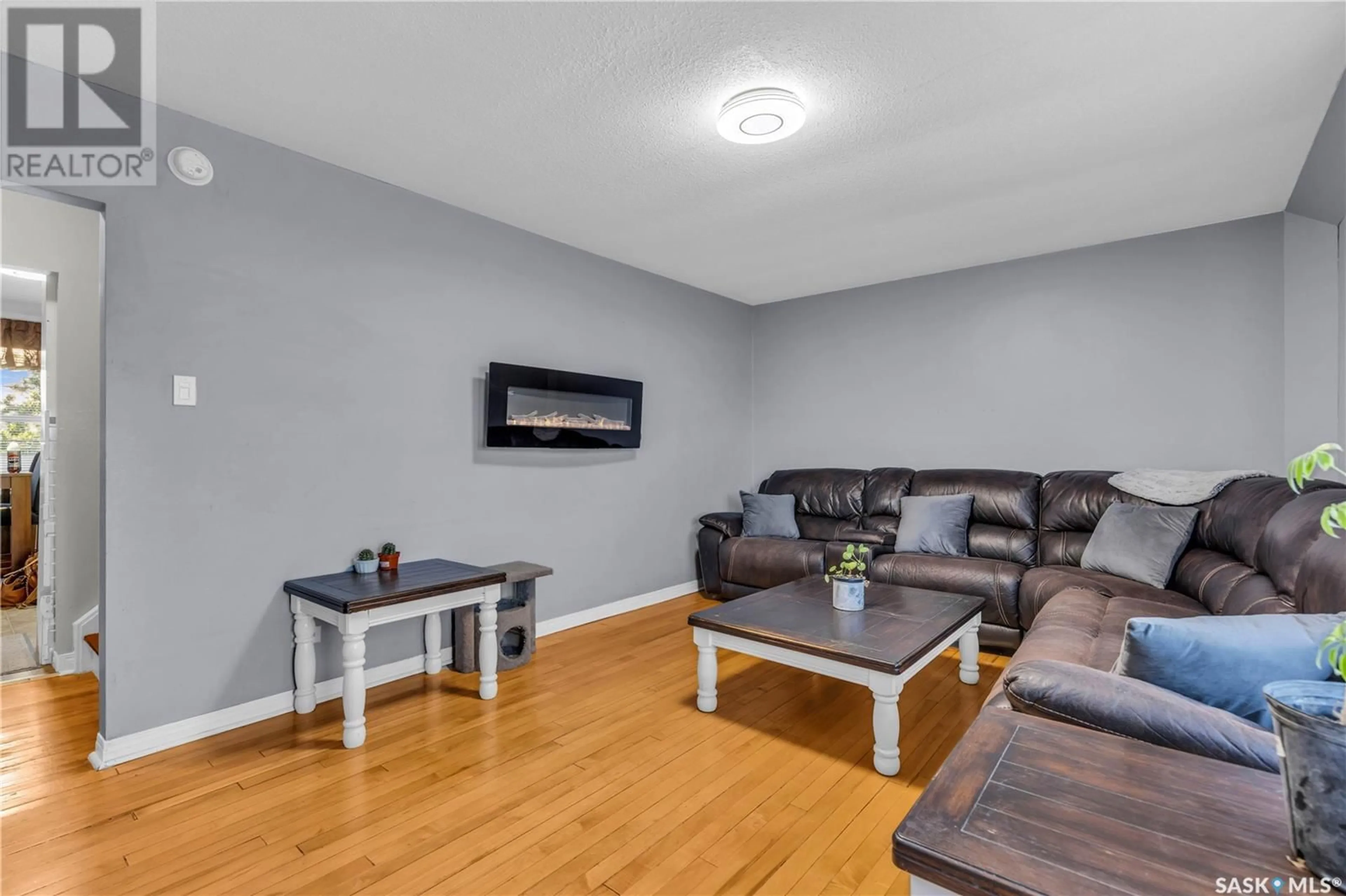 Living room, wood floors for 12 210 Camponi PLACE, Saskatoon Saskatchewan S7M1J7