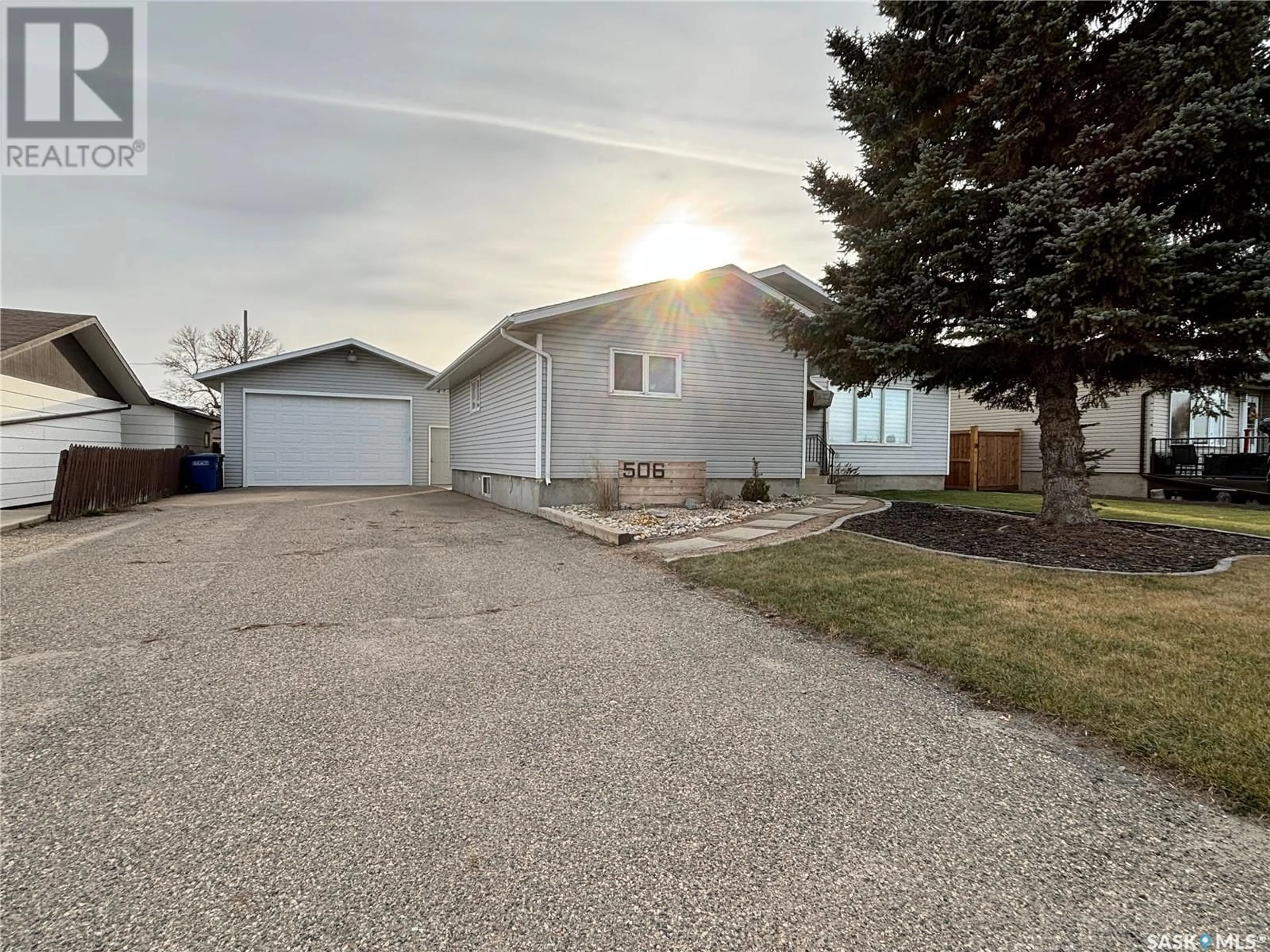 Frontside or backside of a home, the fenced backyard for 506 4th AVENUE, Humboldt Saskatchewan S0K2A0