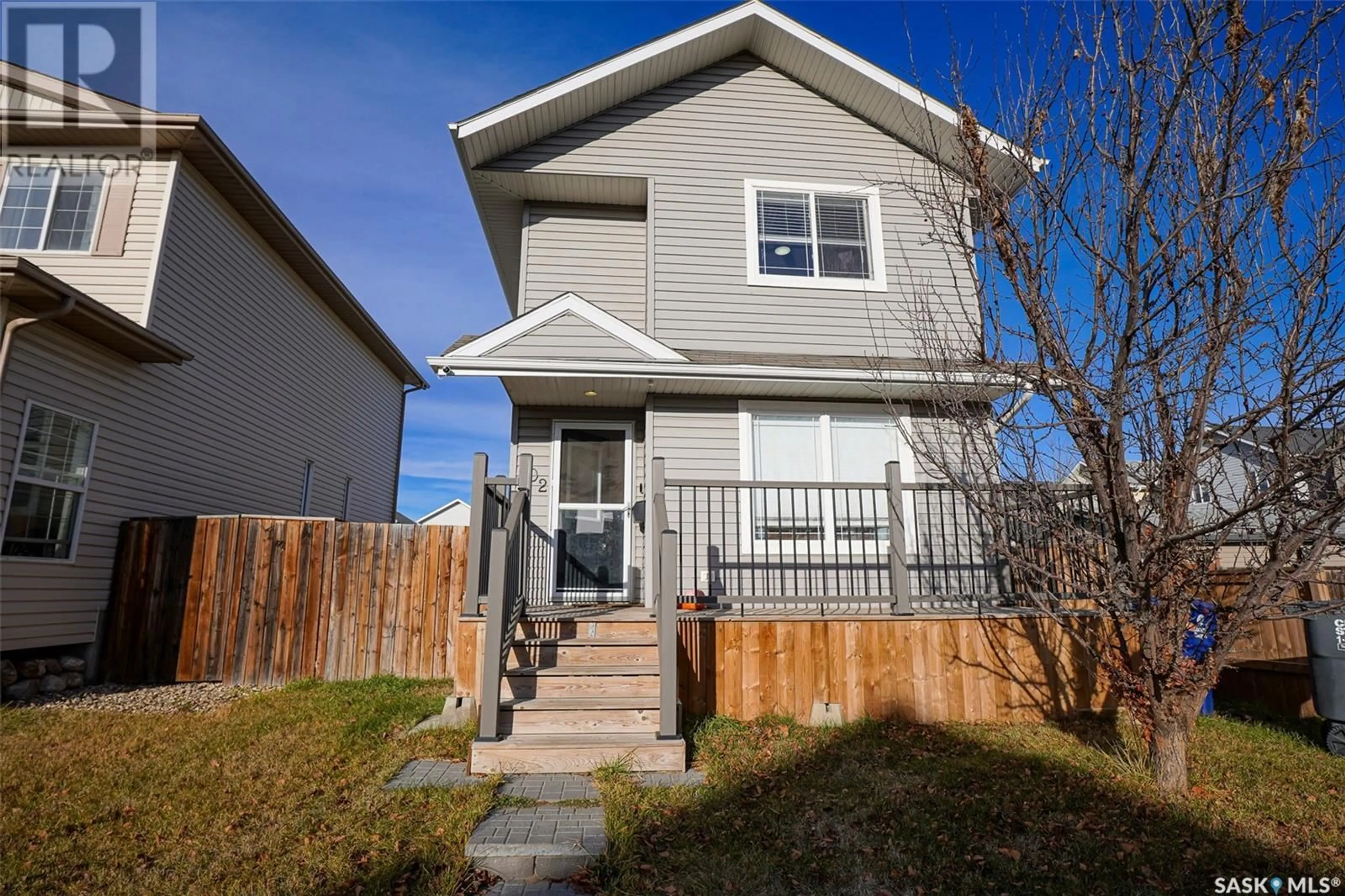 A pic from exterior of the house or condo, the fenced backyard for 102 Blakeney CRESCENT, Saskatoon Saskatchewan S7L7N4