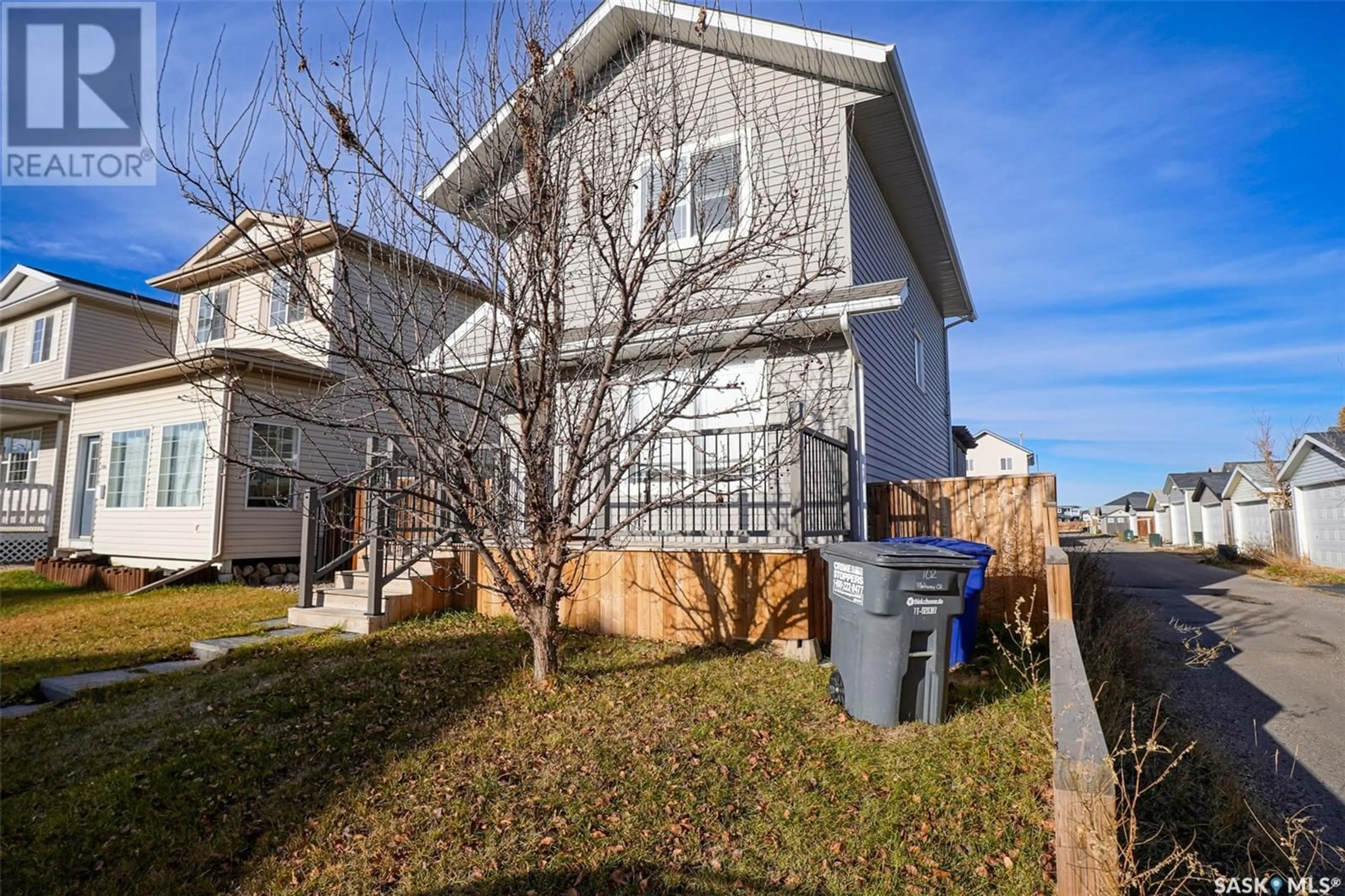 A pic from exterior of the house or condo, the fenced backyard for 102 Blakeney CRESCENT, Saskatoon Saskatchewan S7L7N4