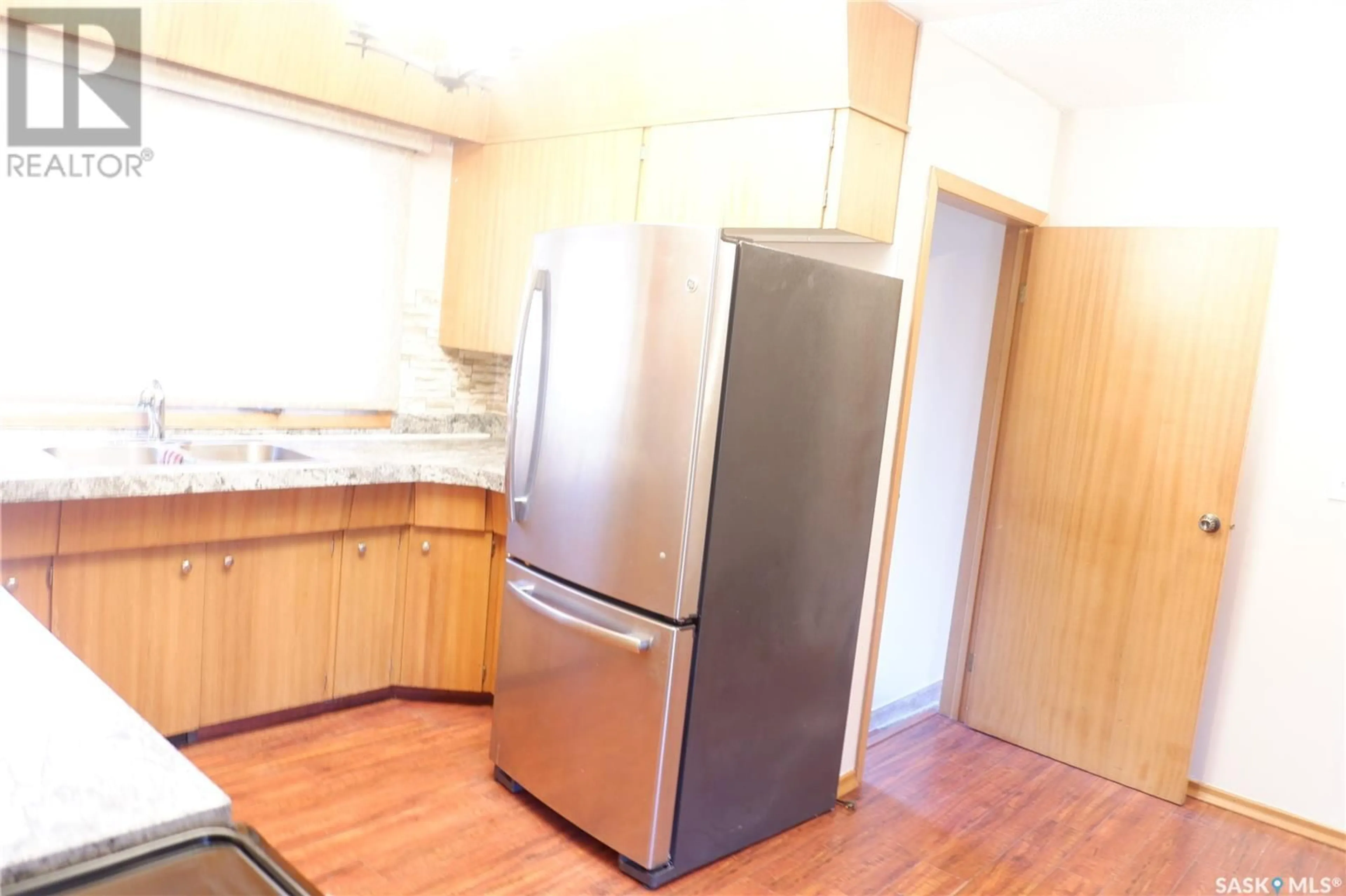 Standard kitchen, wood floors, cottage for 502 4th AVENUE E, Assiniboia Saskatchewan S0H0B0