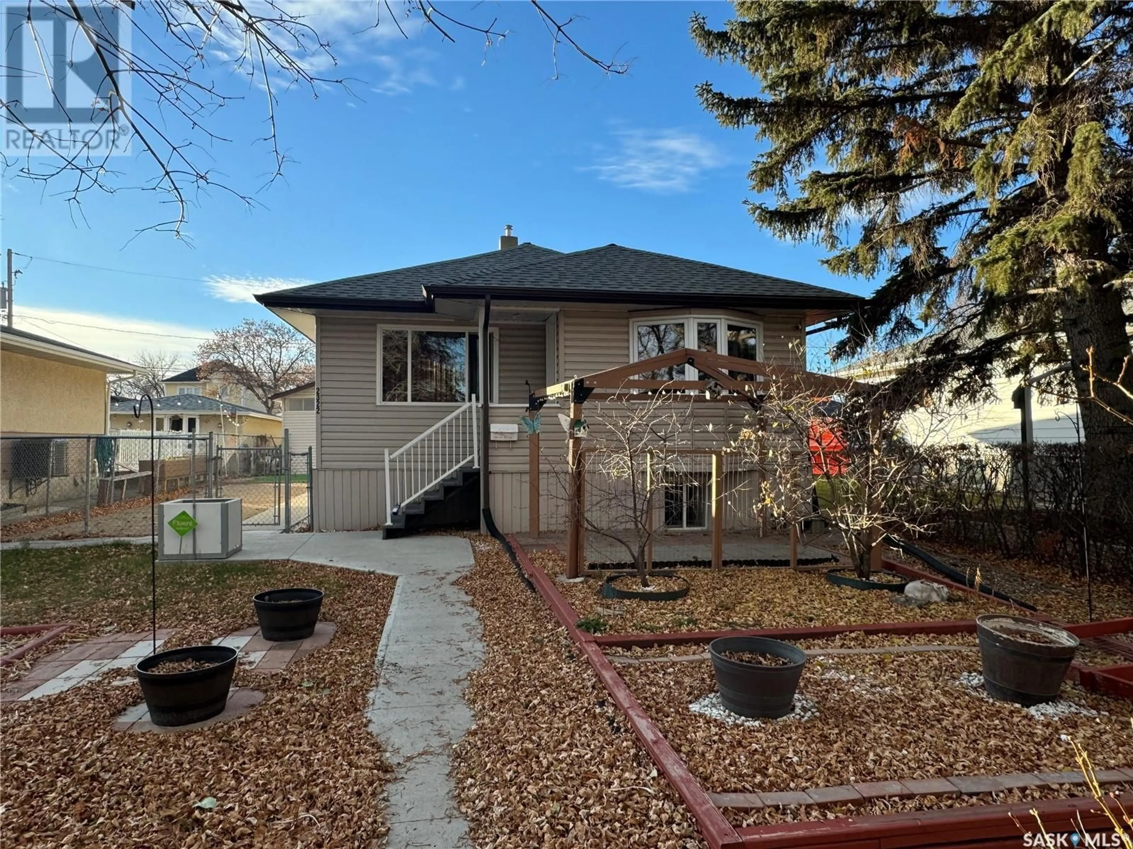 A pic from exterior of the house or condo, the fenced backyard for 2322 MACKAY STREET, Regina Saskatchewan S4N2T1