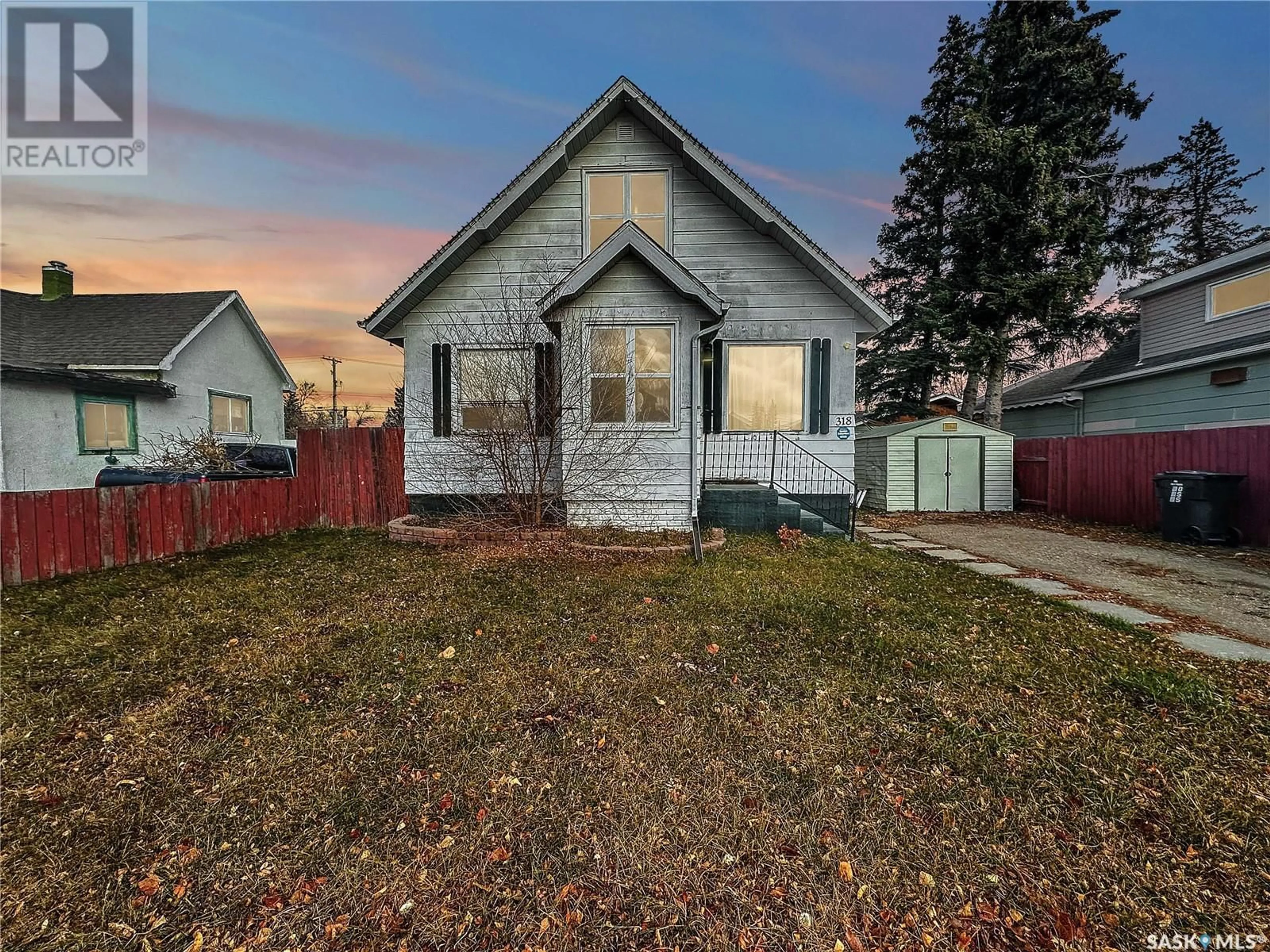 Frontside or backside of a home, the fenced backyard for 318 4th AVENUE W, Melville Saskatchewan S0A2P0