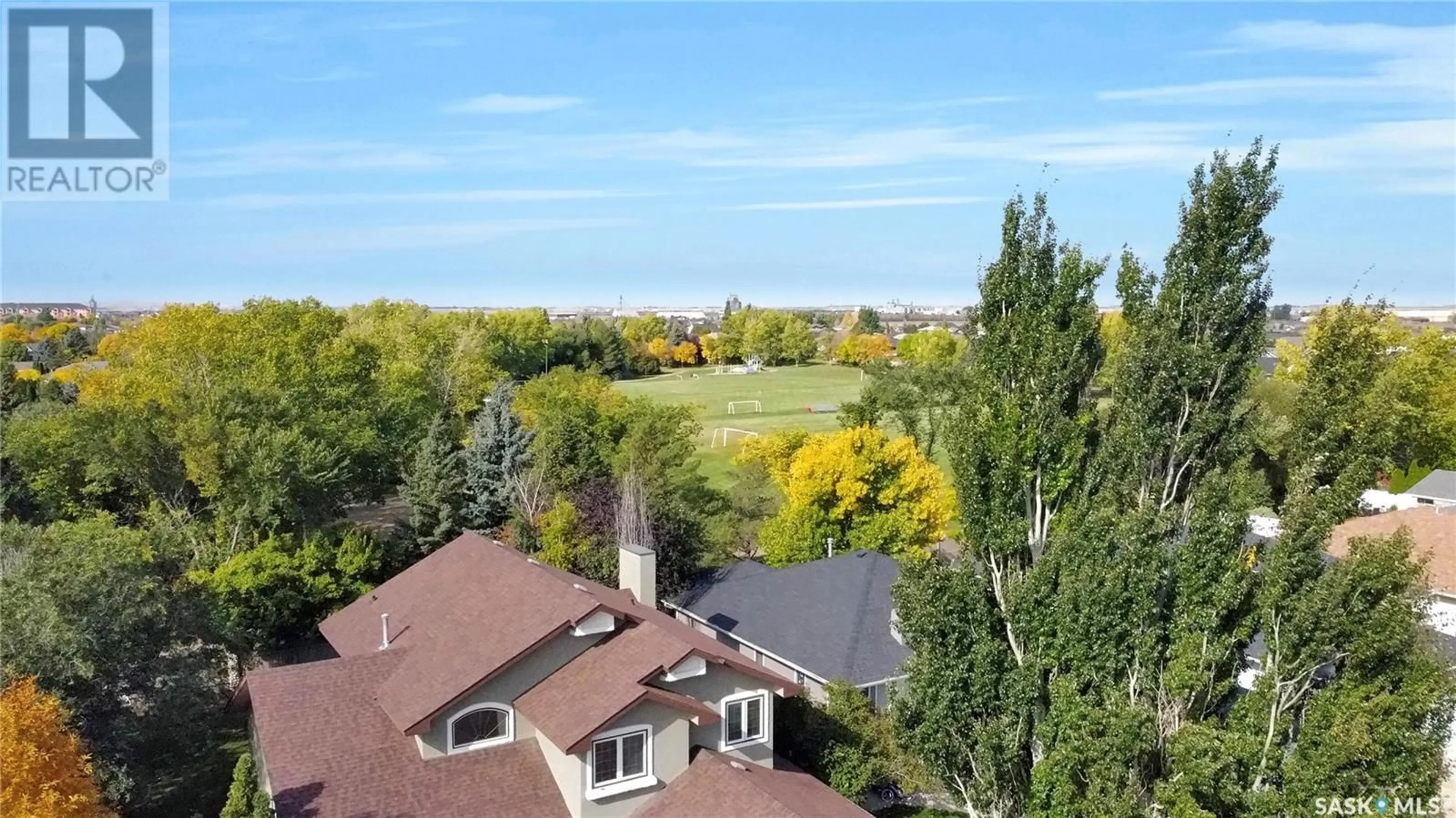 A pic from exterior of the house or condo, the fenced backyard for 128 Blue Sage DRIVE, Moose Jaw Saskatchewan S6J1G7