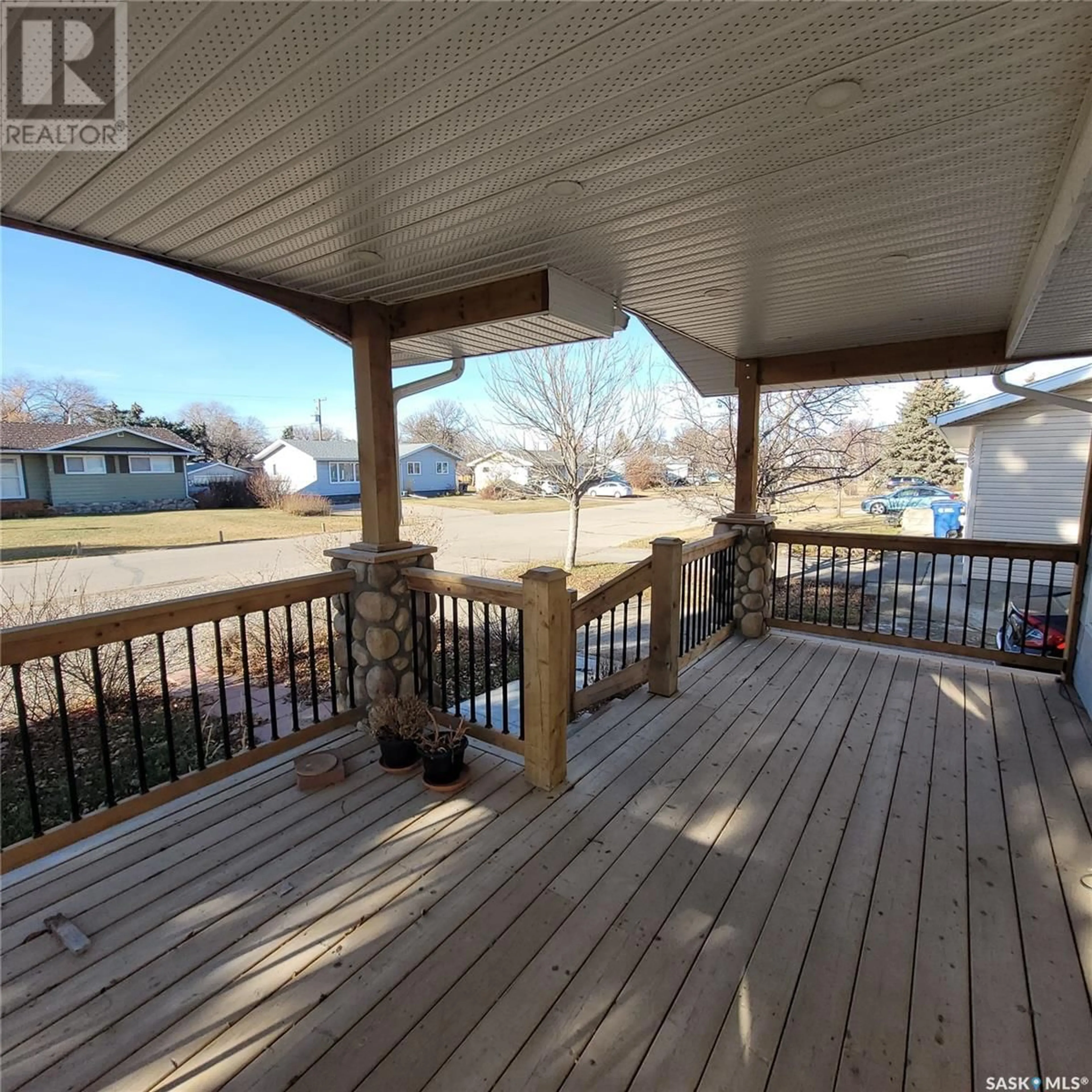 Frontside or backside of a home, the fenced backyard for 307 Birch STREET, Caronport Saskatchewan S0H0S0