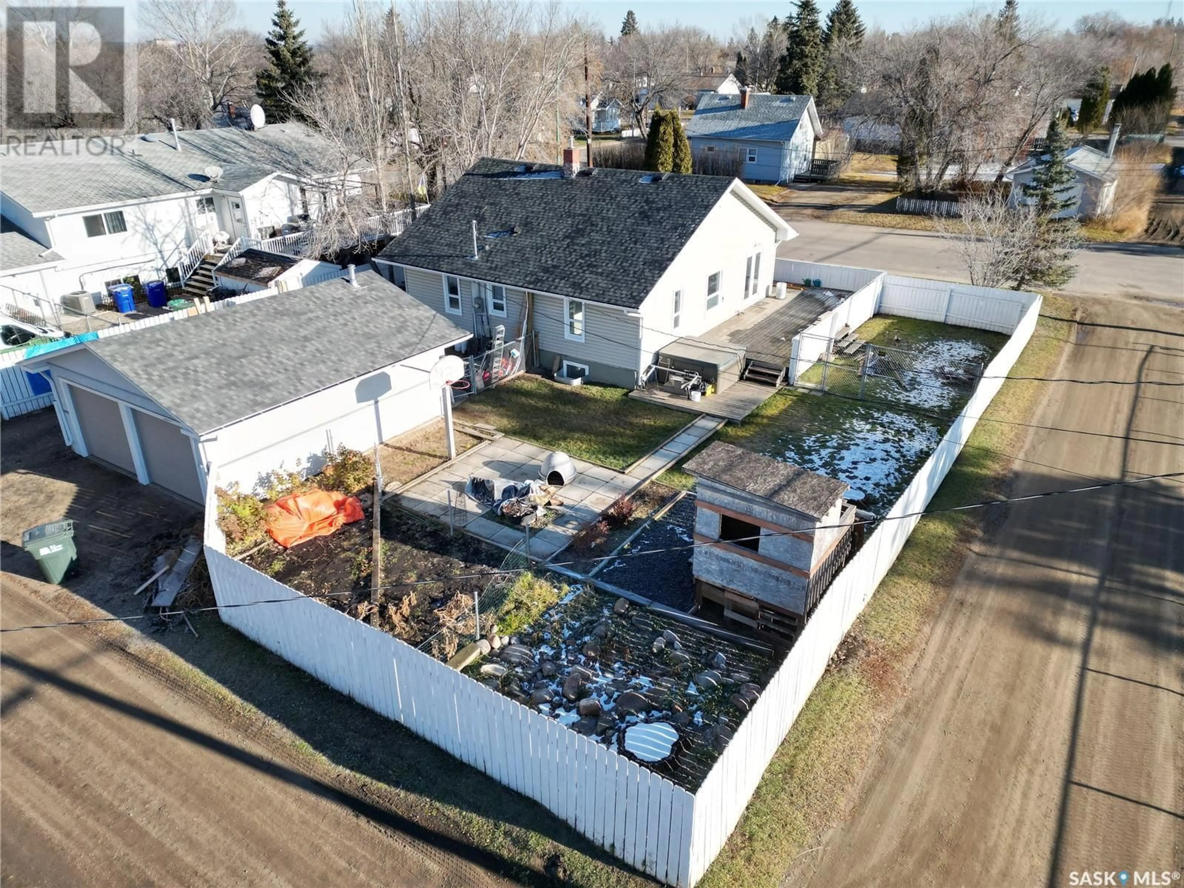 Frontside or backside of a home, the fenced backyard for 2215 5th AVENUE W, Prince Albert Saskatchewan S6V5J3