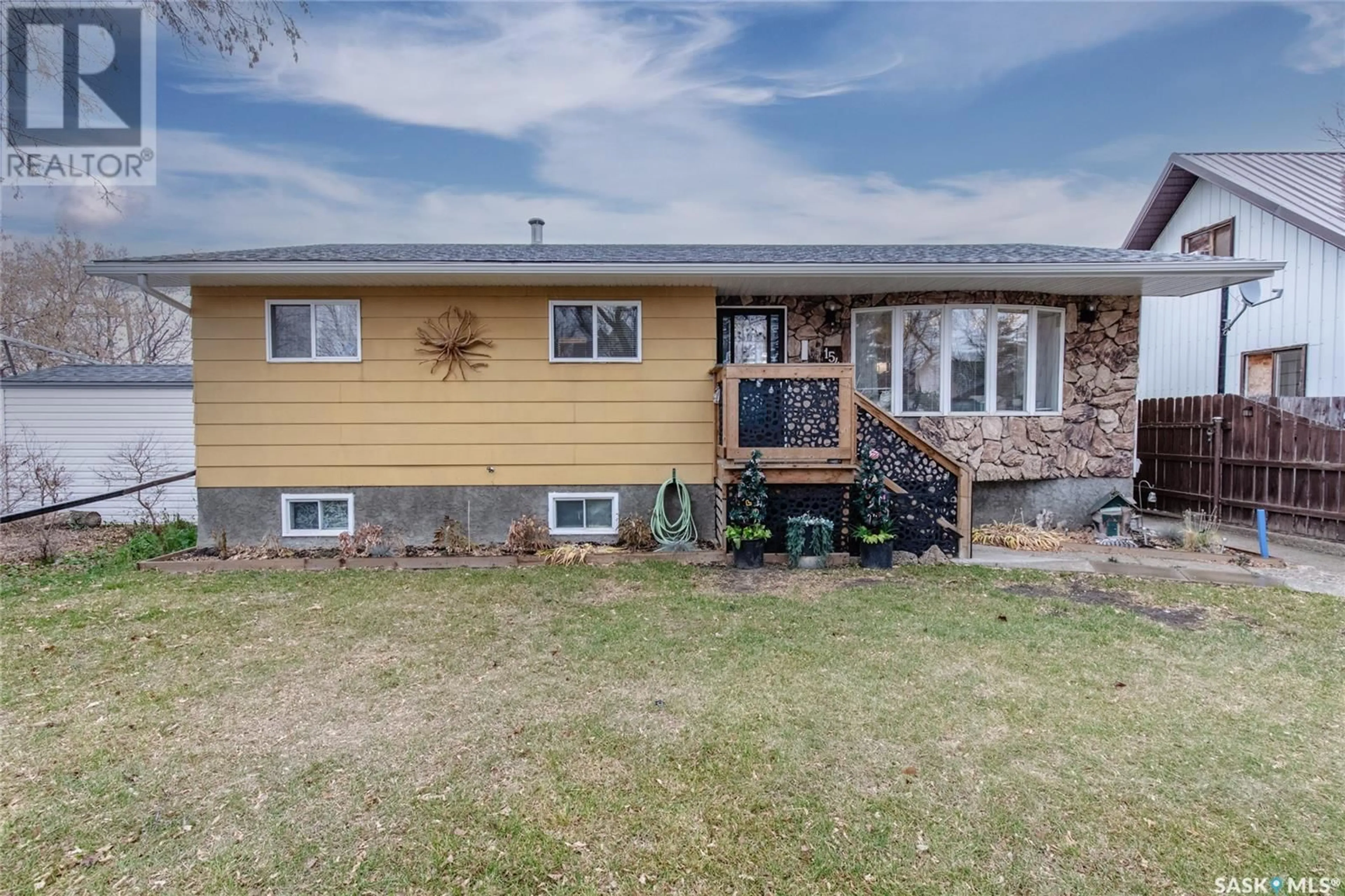 Frontside or backside of a home, the fenced backyard for 154 Coteau STREET W, Moose Jaw Saskatchewan S6H5C5