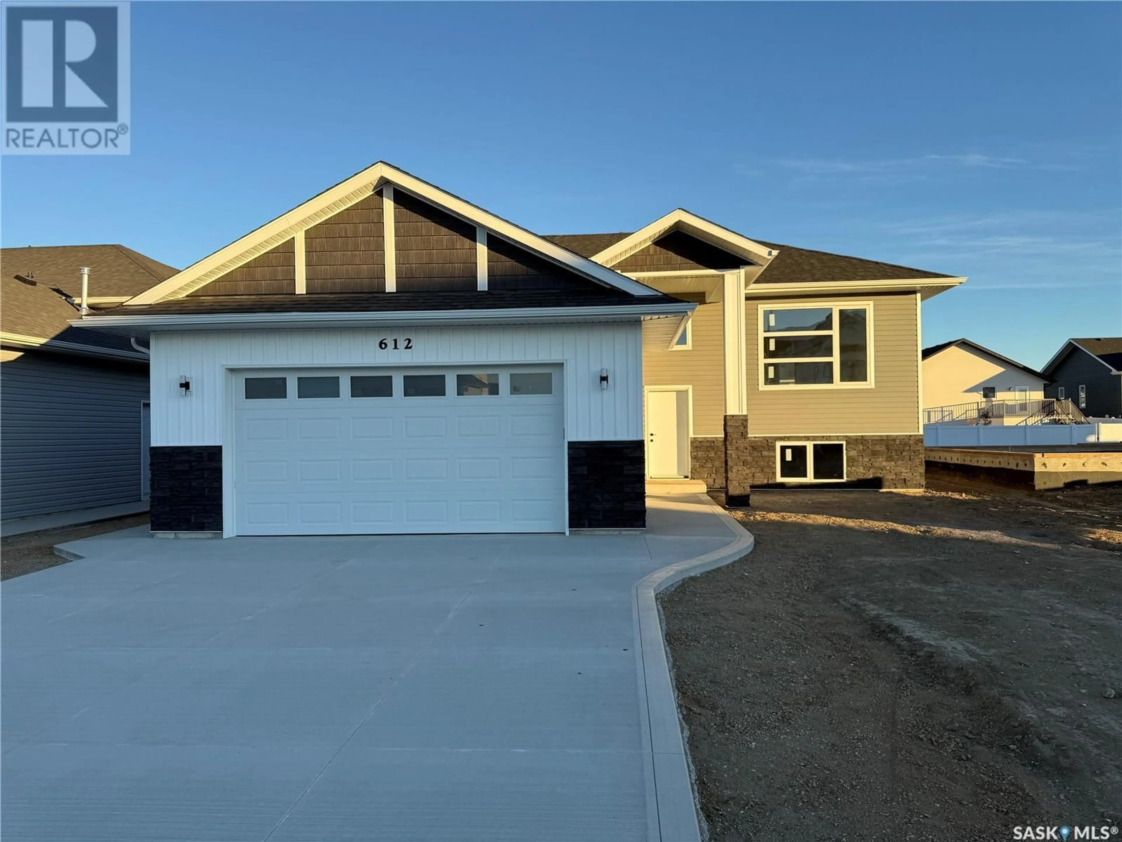 Frontside or backside of a home, the street view for 612 Weir CRESCENT, Warman Saskatchewan S0K4S4