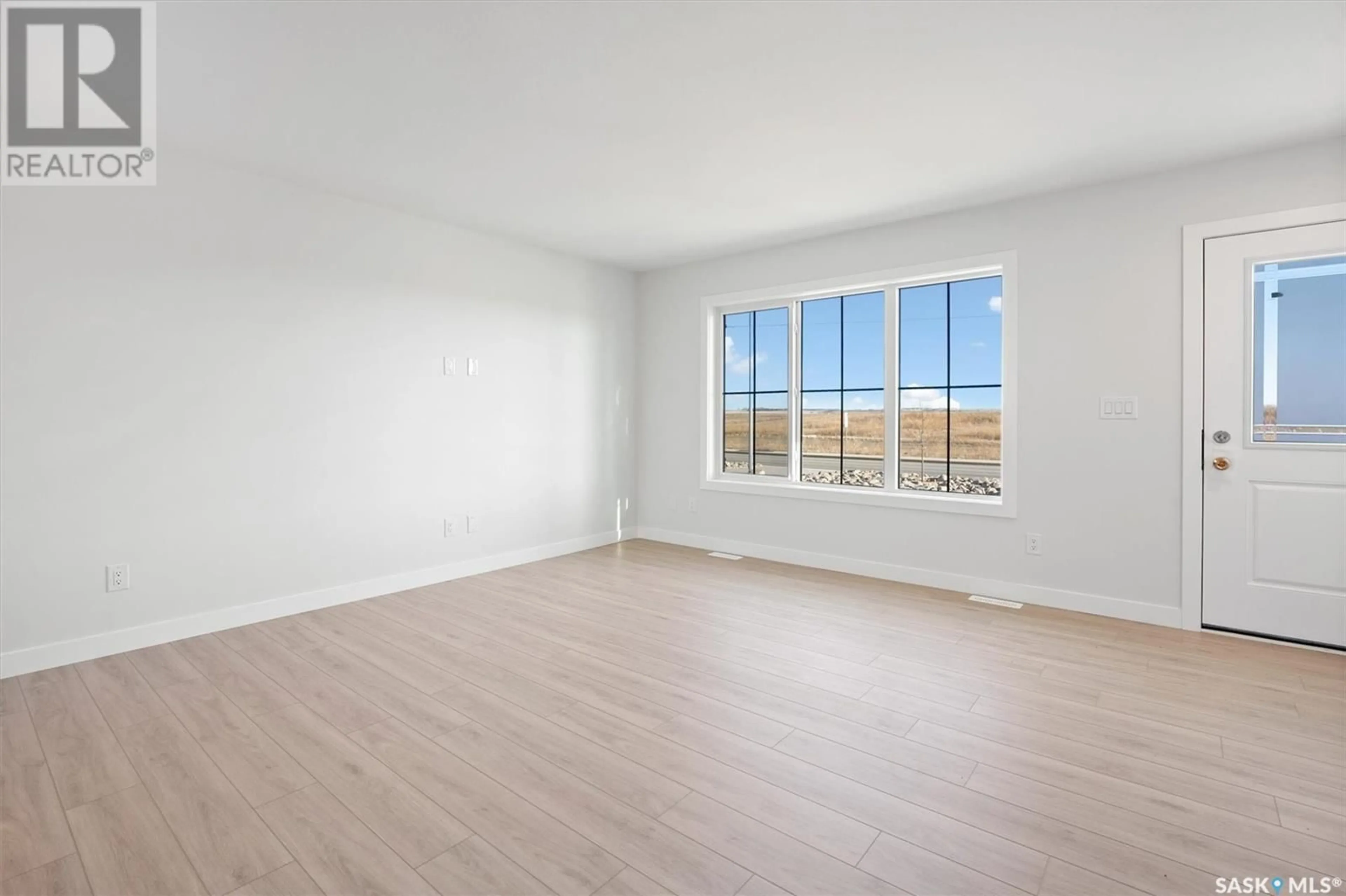 A pic of a room, wood floors for 662 McOrmond DRIVE, Saskatoon Saskatchewan S7V1W8