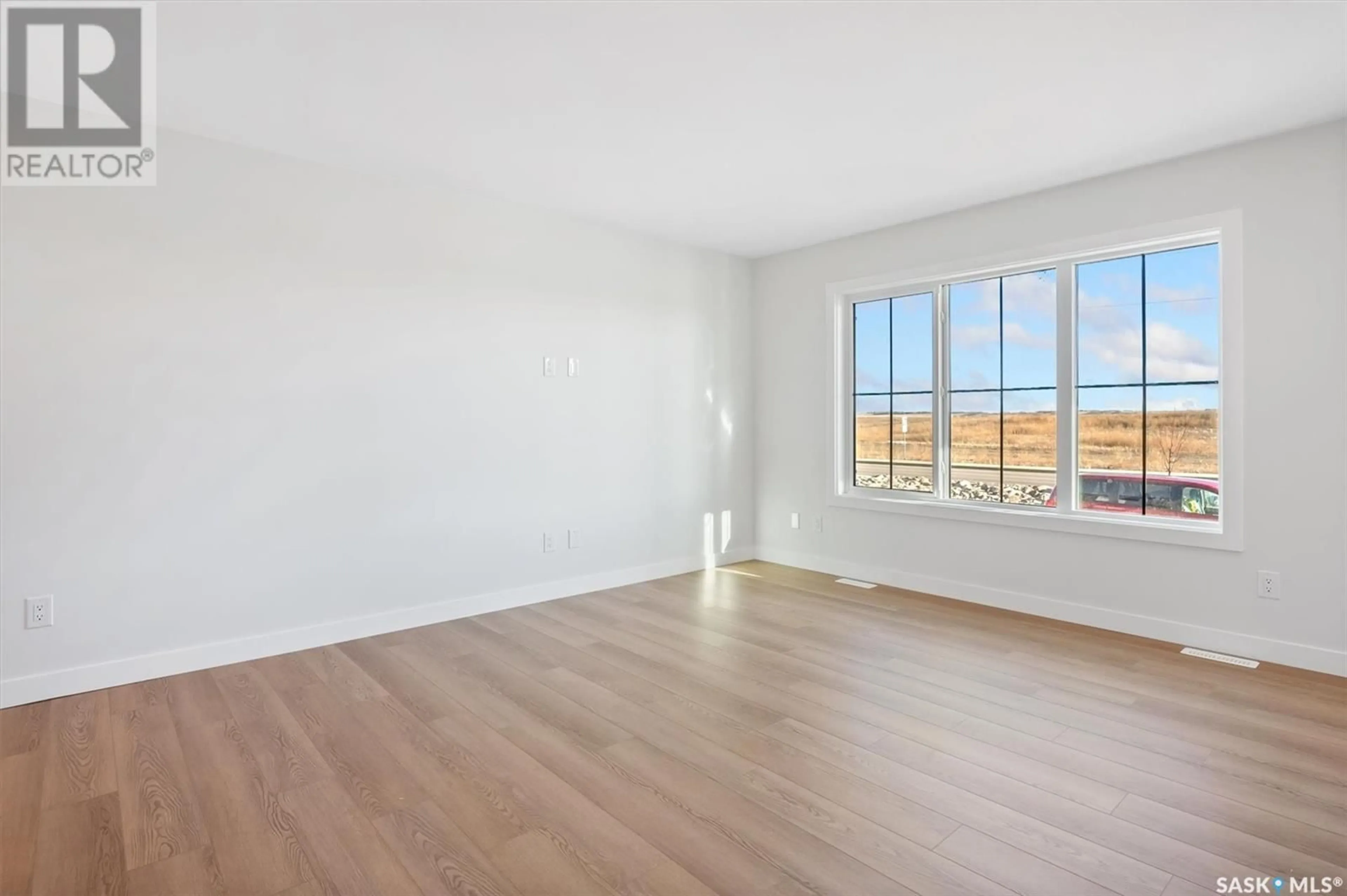 A pic of a room, wood floors for 666 McOrmond DRIVE, Saskatoon Saskatchewan S7V1W8