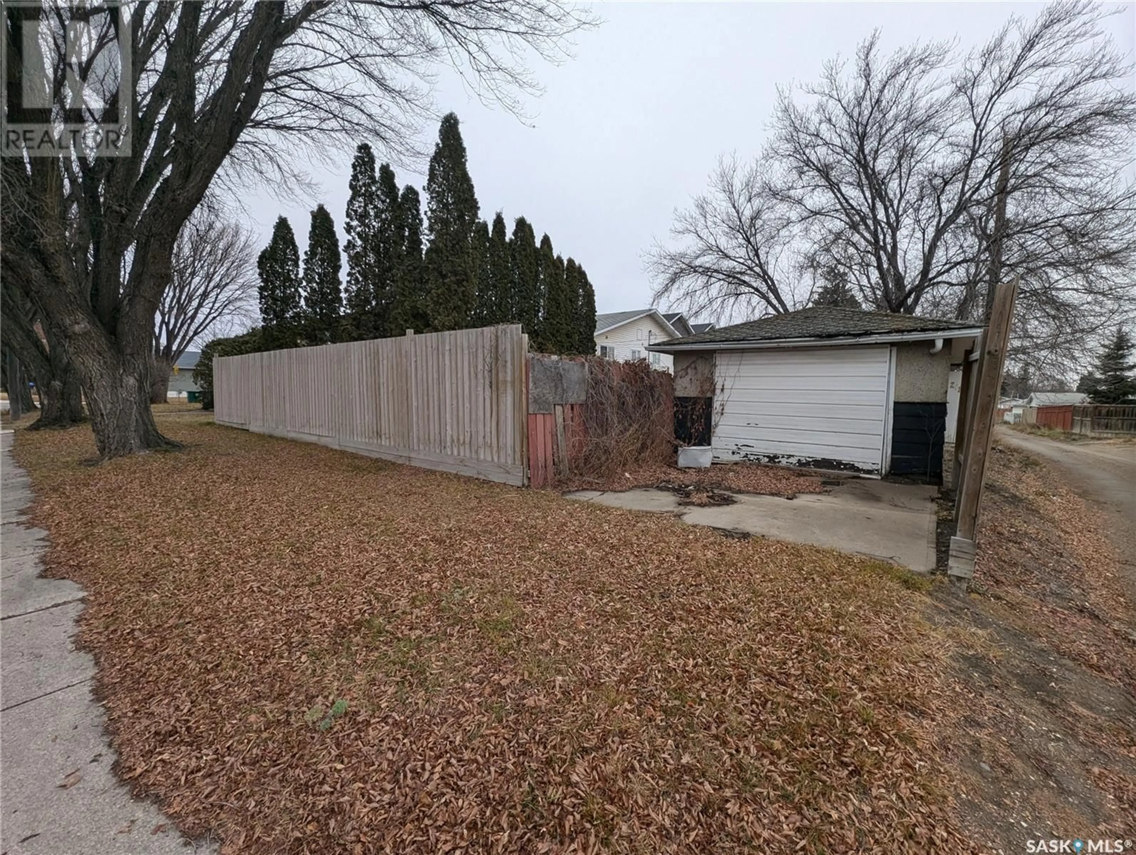 Frontside or backside of a home, the fenced backyard for 2616 20th STREET W, Saskatoon Saskatchewan S7M1B6