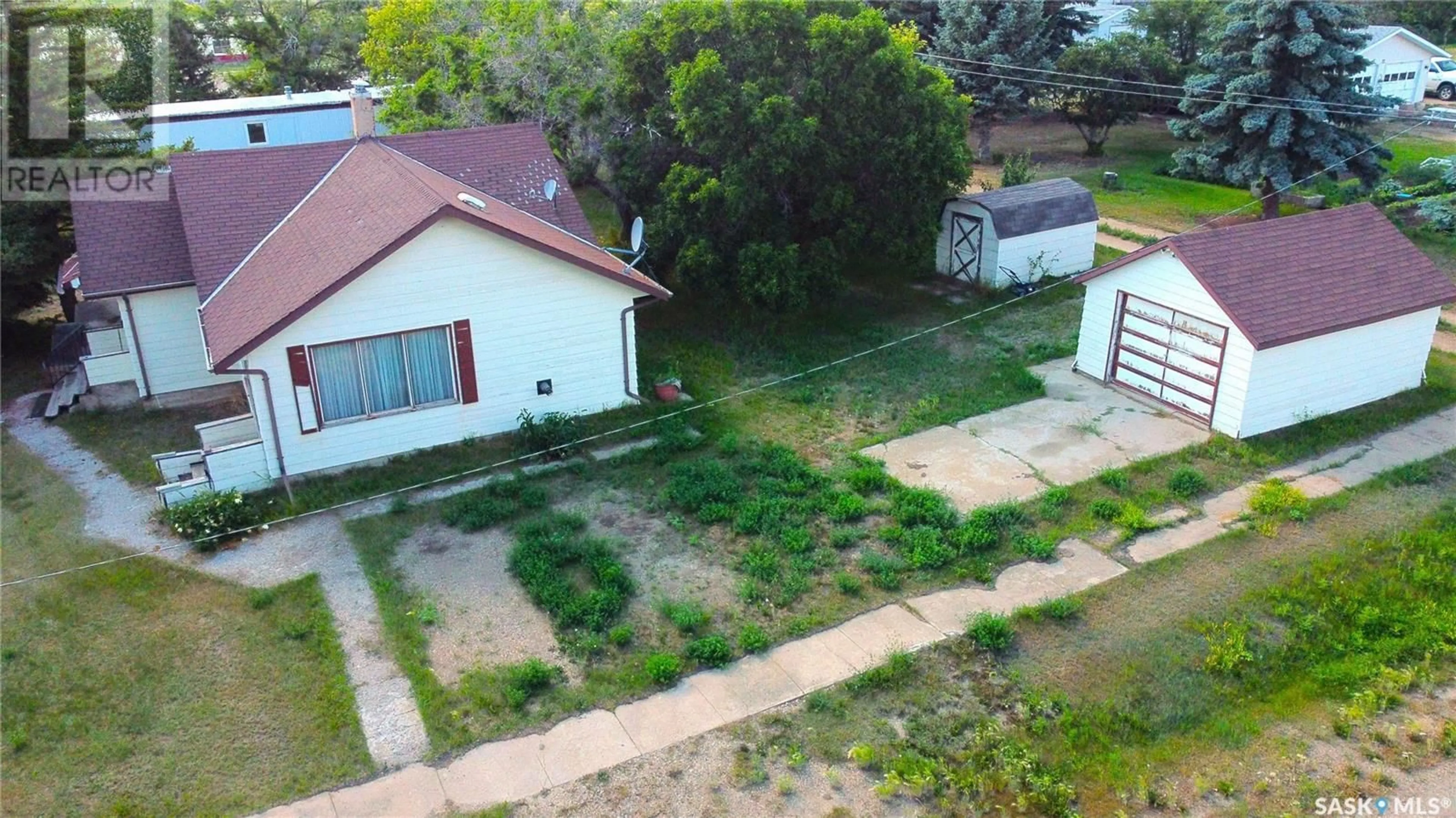 Frontside or backside of a home, the fenced backyard for 314 Railway AVENUE, Neville Saskatchewan S0N1T0