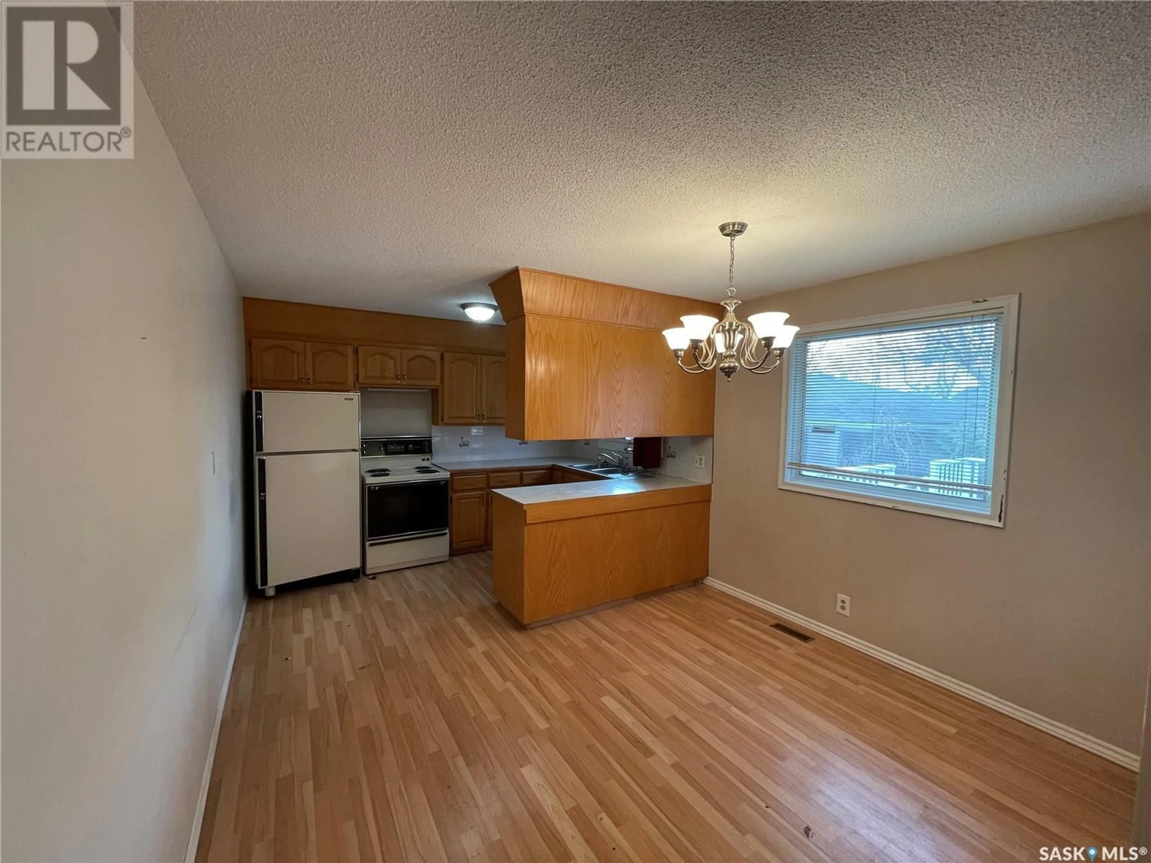 A pic of a room, wood floors for 30 IRVIN CRESCENT, Regina Saskatchewan S4R5L2